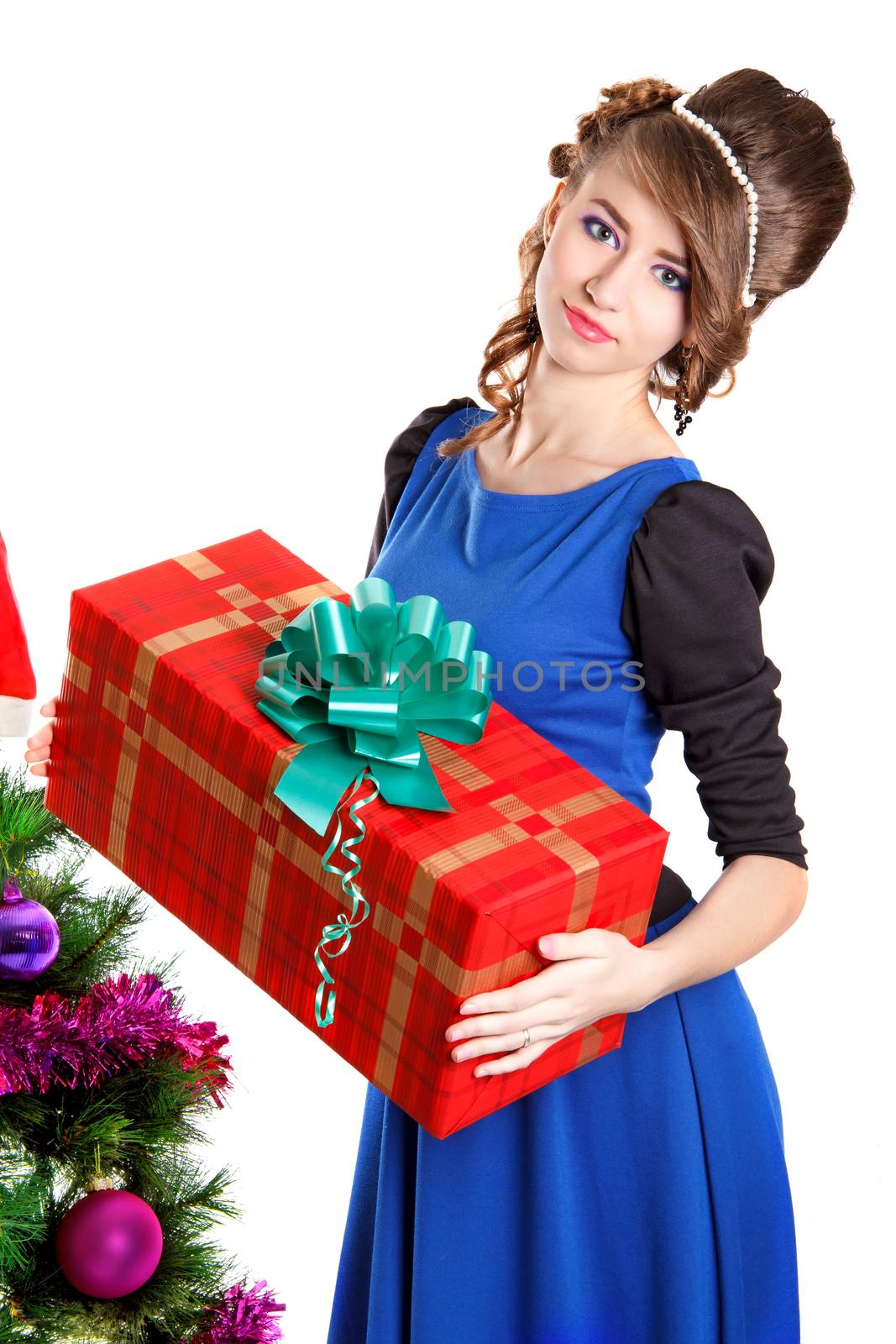 Portrait of a beautiful young woman holding a present near the C by Artzzz