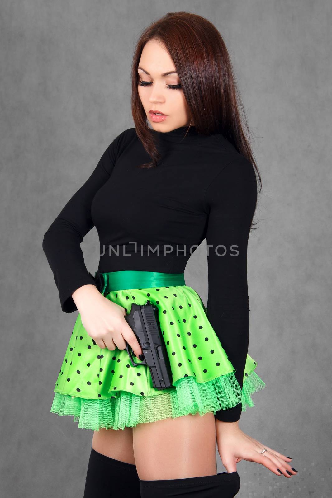 Portrait of a young attractive woman in a bright green skirt wit by Artzzz