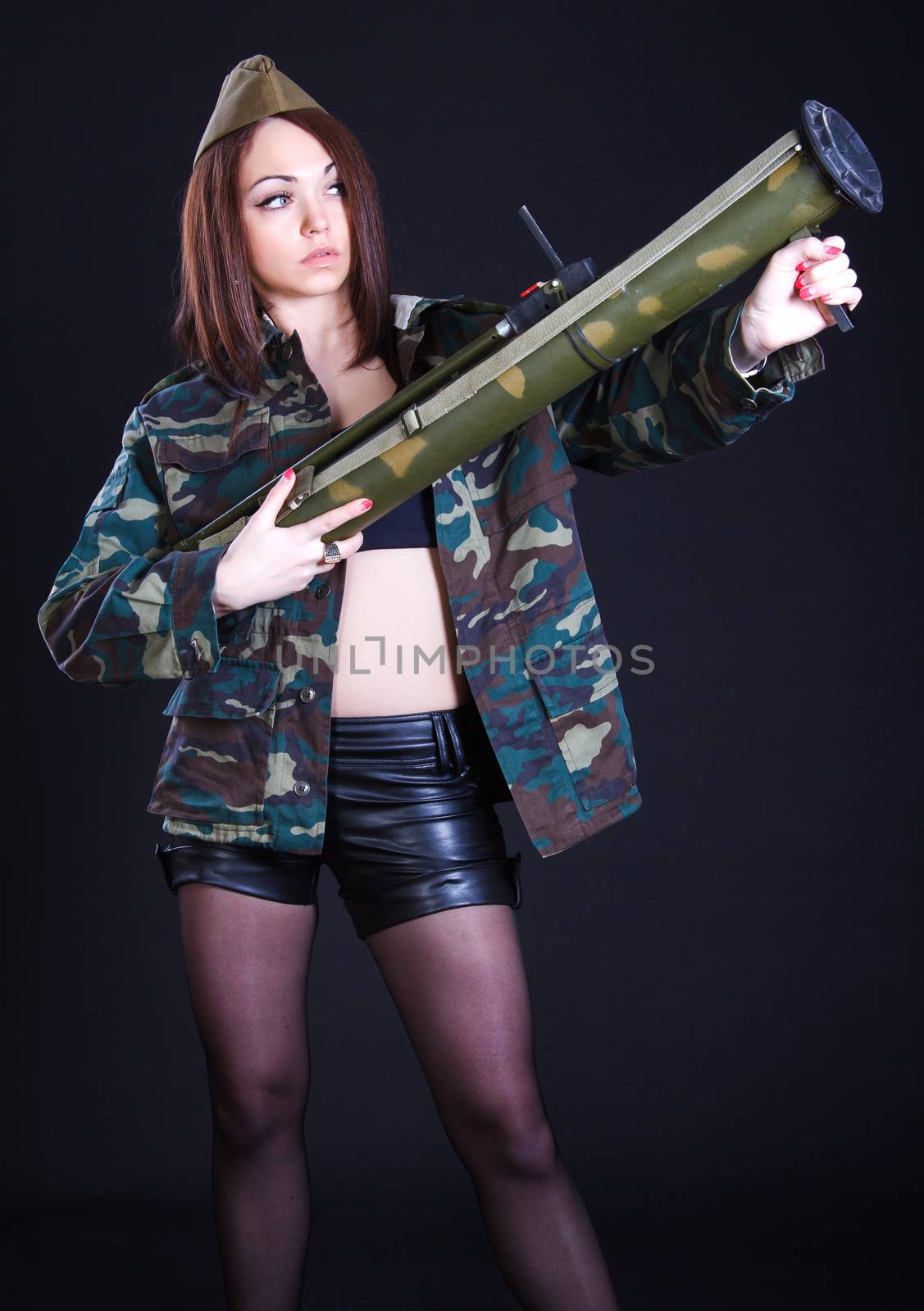 Young woman in the military uniform with the bazooka by Artzzz