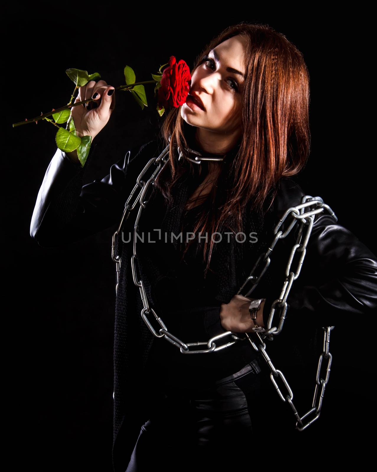 Beautiful young woman with chains and a red rose by Artzzz