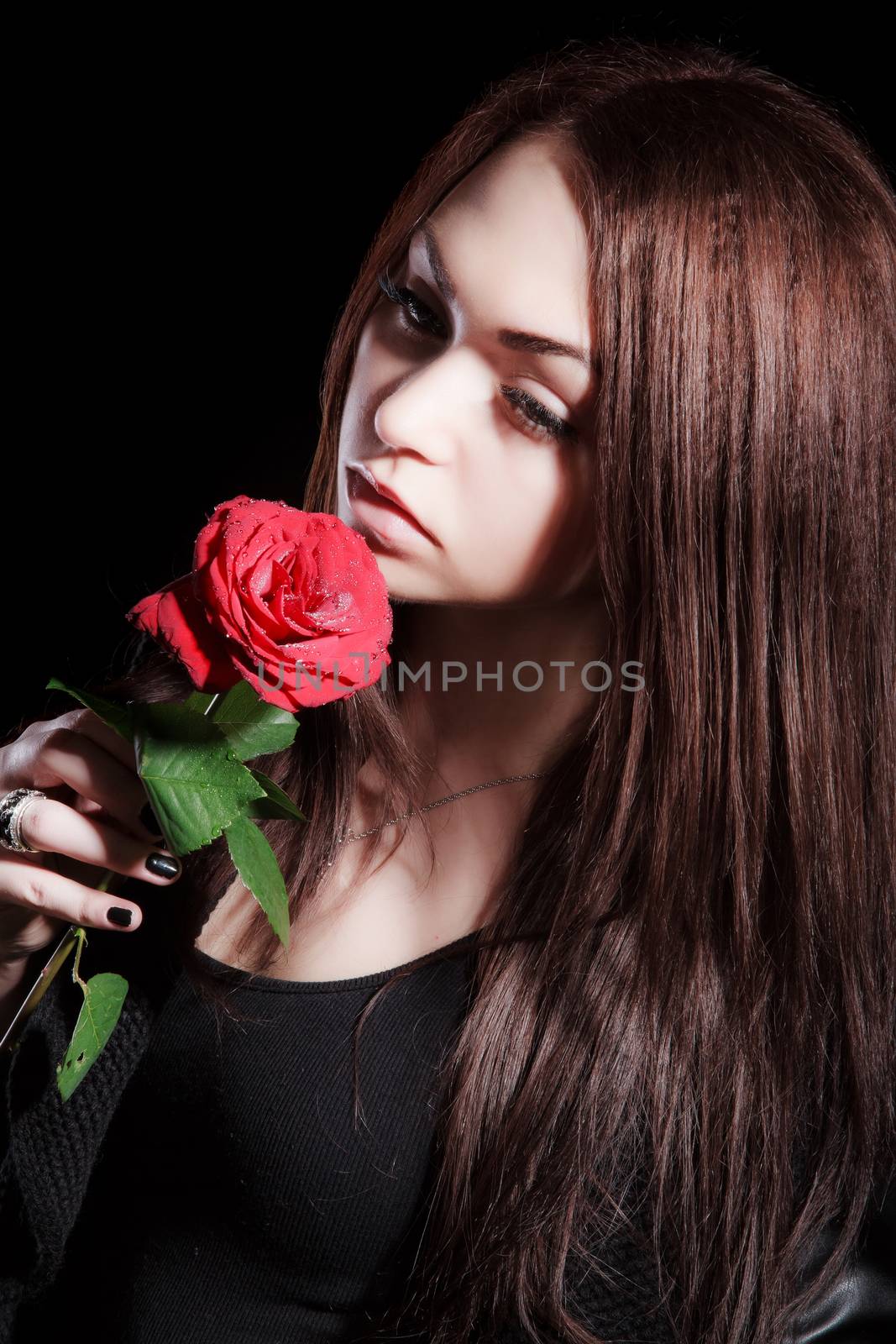 Closeup portrait of a pale beautiful young woman with a red rose by Artzzz