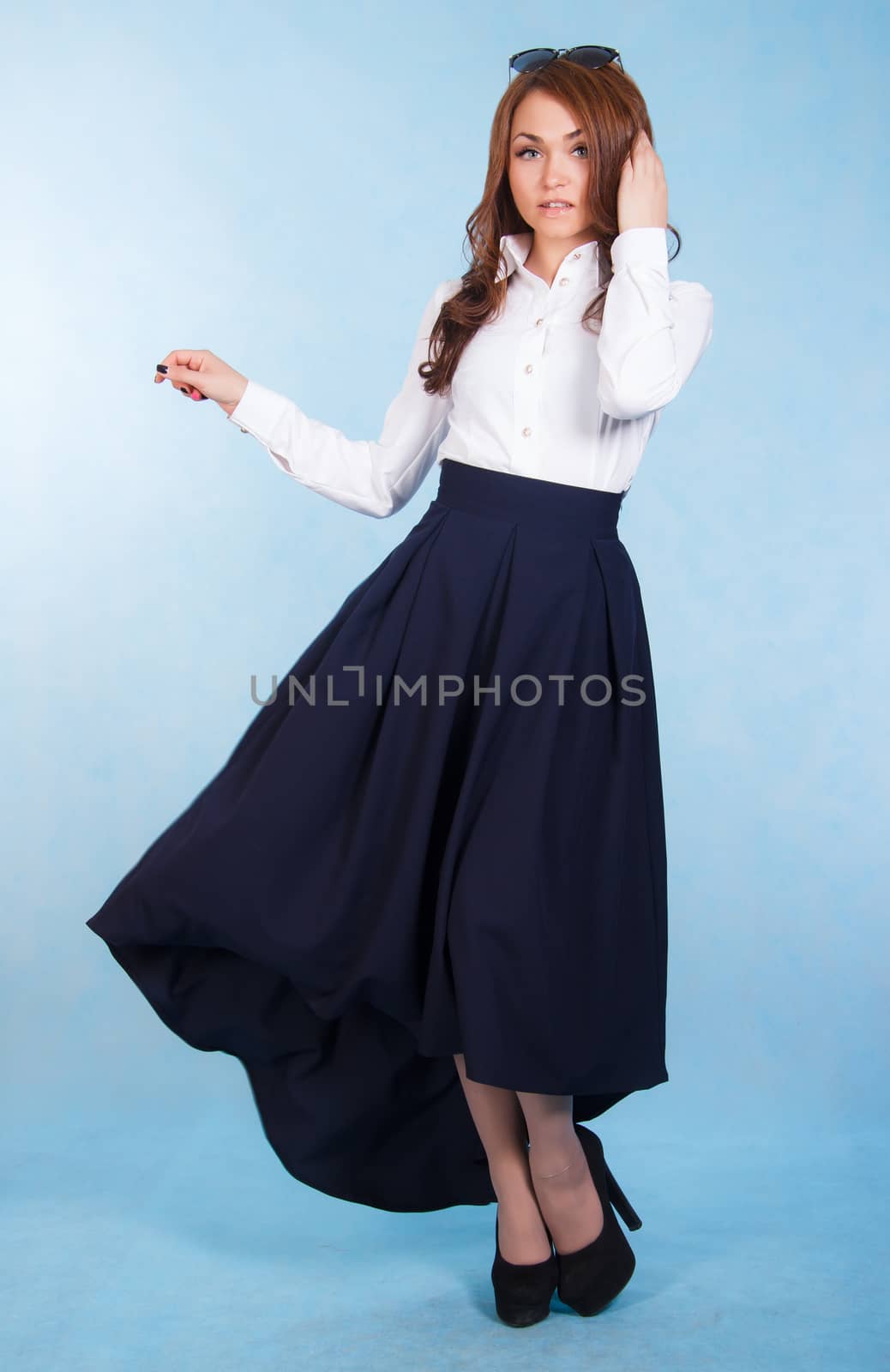 Beautiful young woman in a long blue skirt by Artzzz