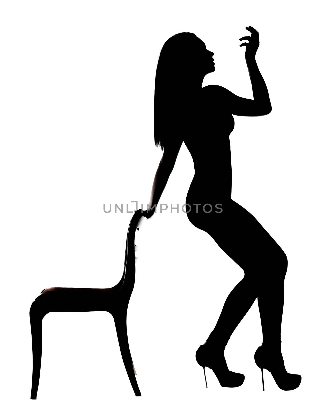 Silhouette of a woman dancing near the chair by Artzzz