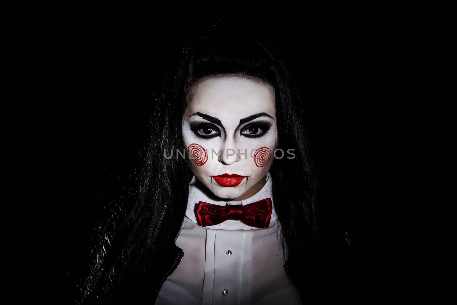Woman with a Saw film cosplay makeup over black background
