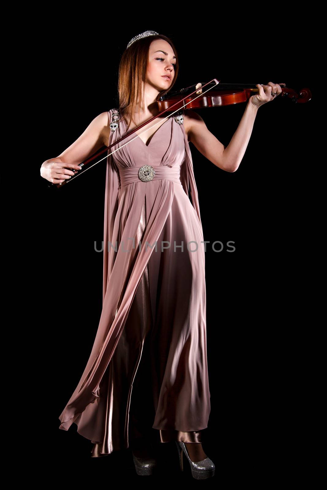 Pretty young woman playing a violin by Artzzz