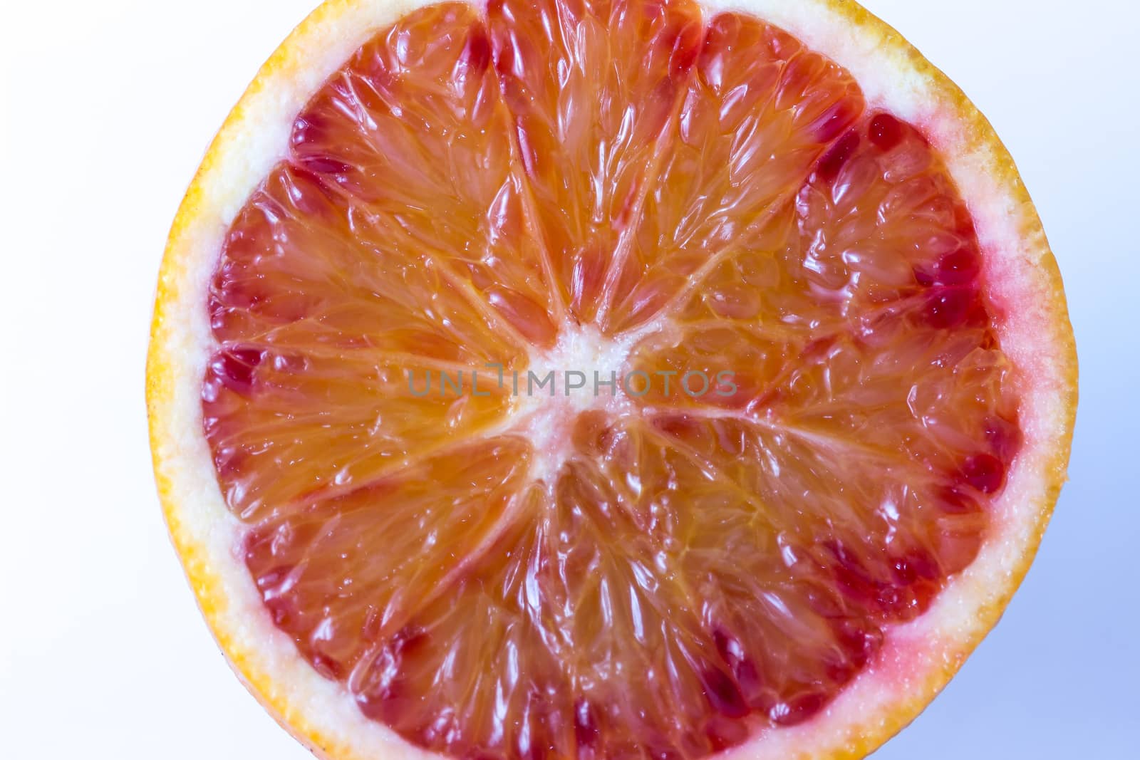 Fresh juicy slice of orange on white background