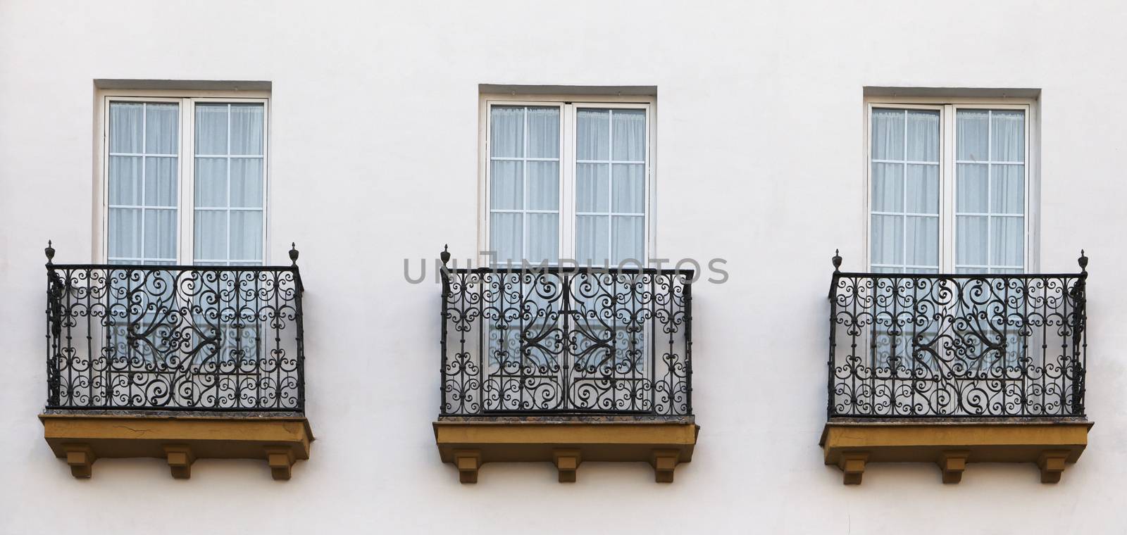 Decorative balconies of a house in Seville, Spain