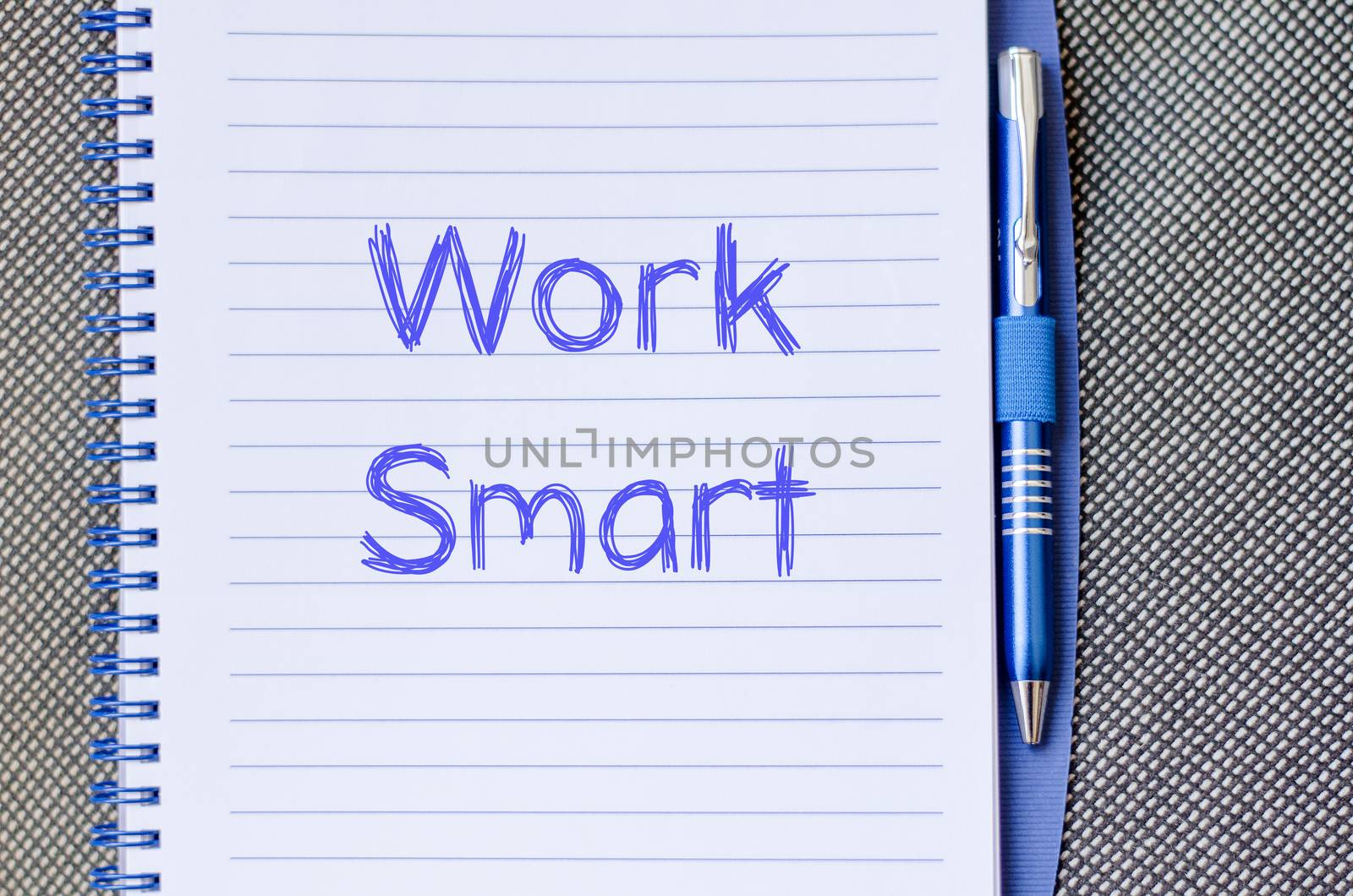 Work smart text concept write on notebook with pen