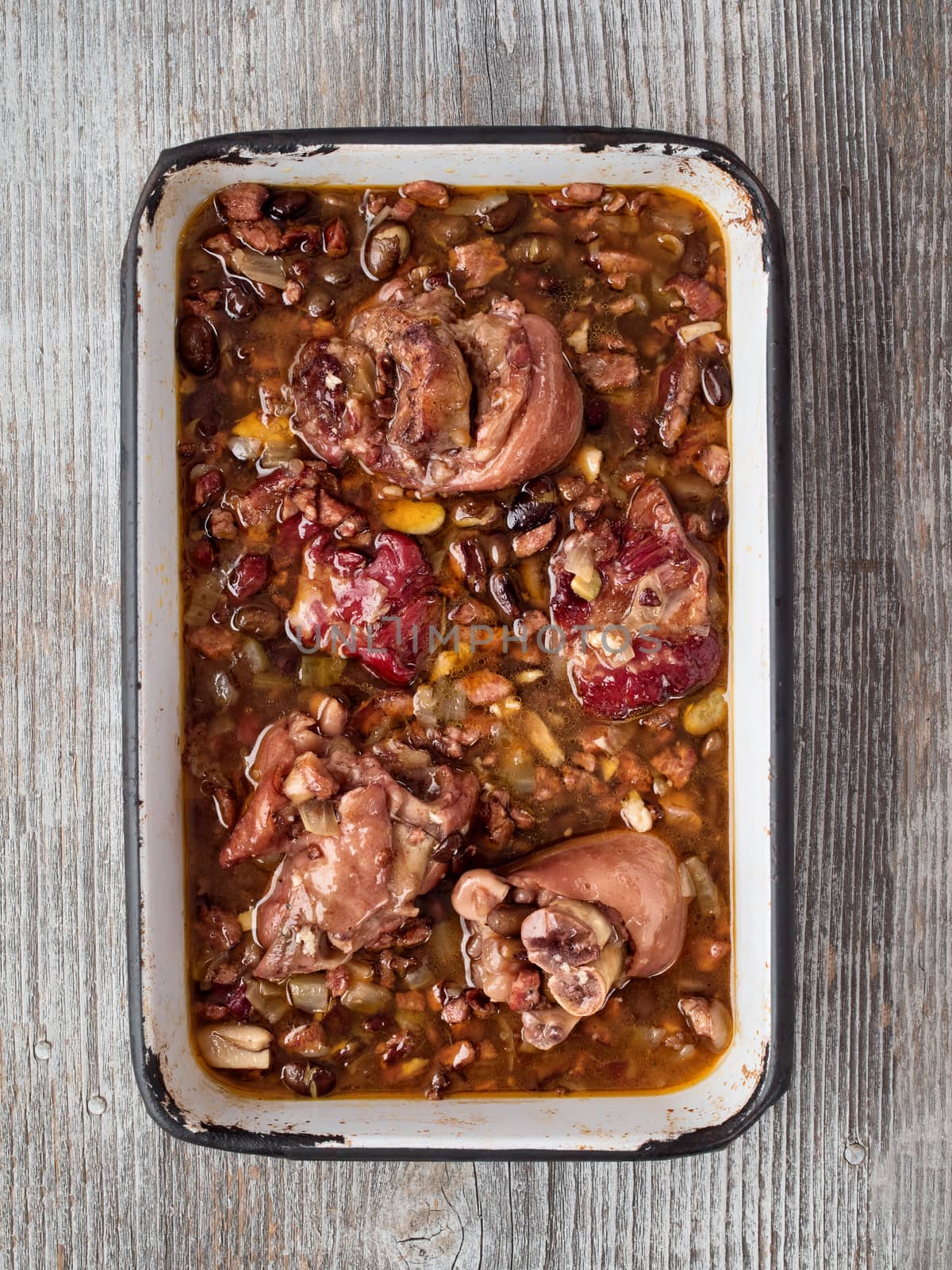 close up of rustic brazilian feijoada pork with black bean stew