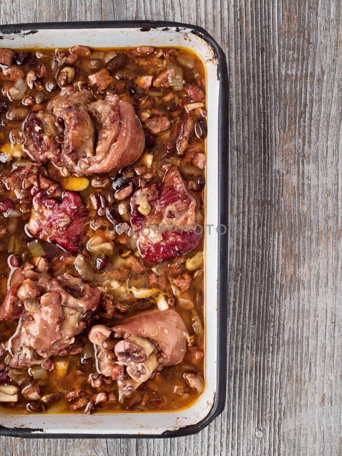 close up of rustic brazilian feijoada pork with black bean stew