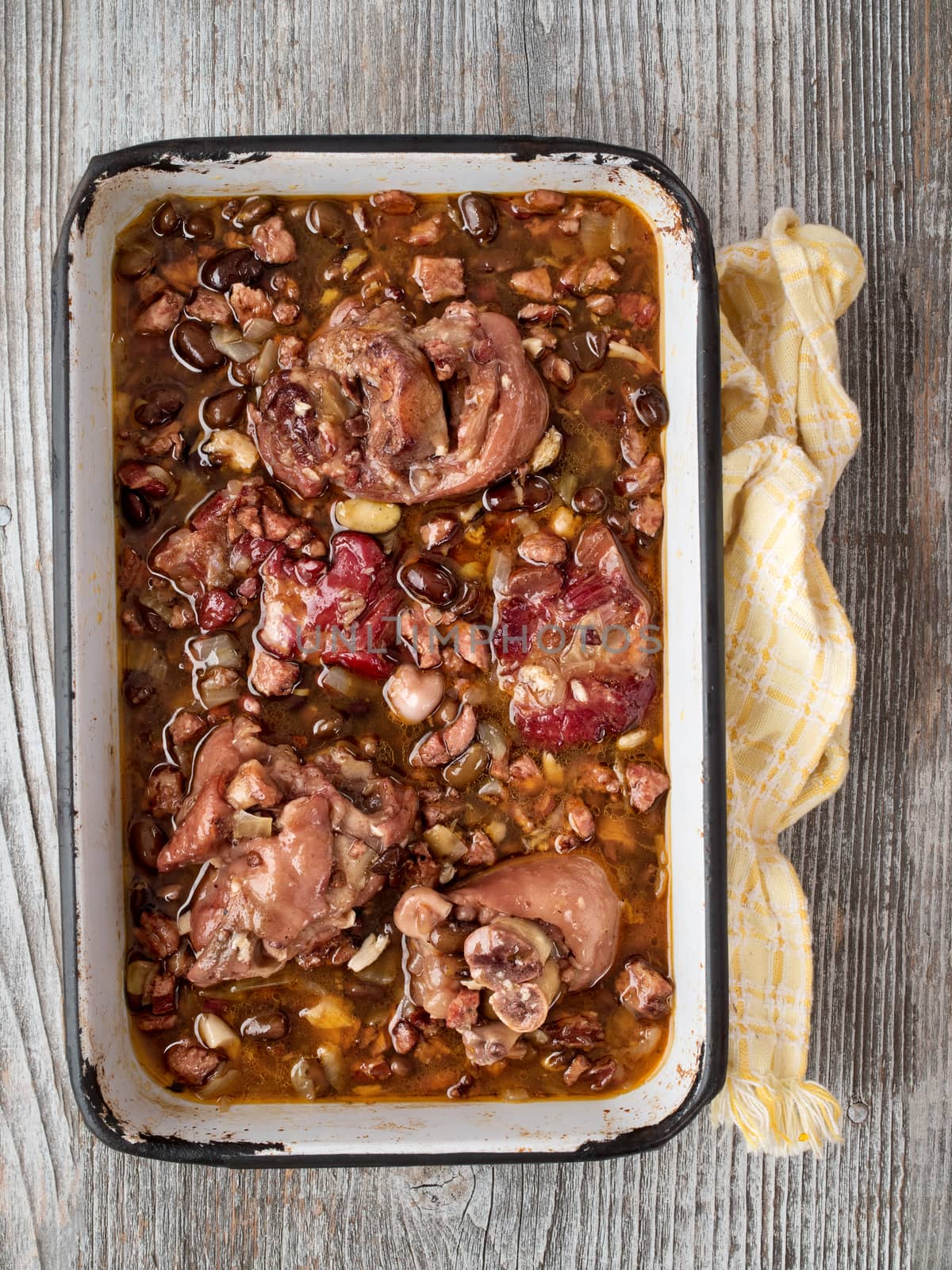 close up of rustic brazilian feijoada pork with black bean stew