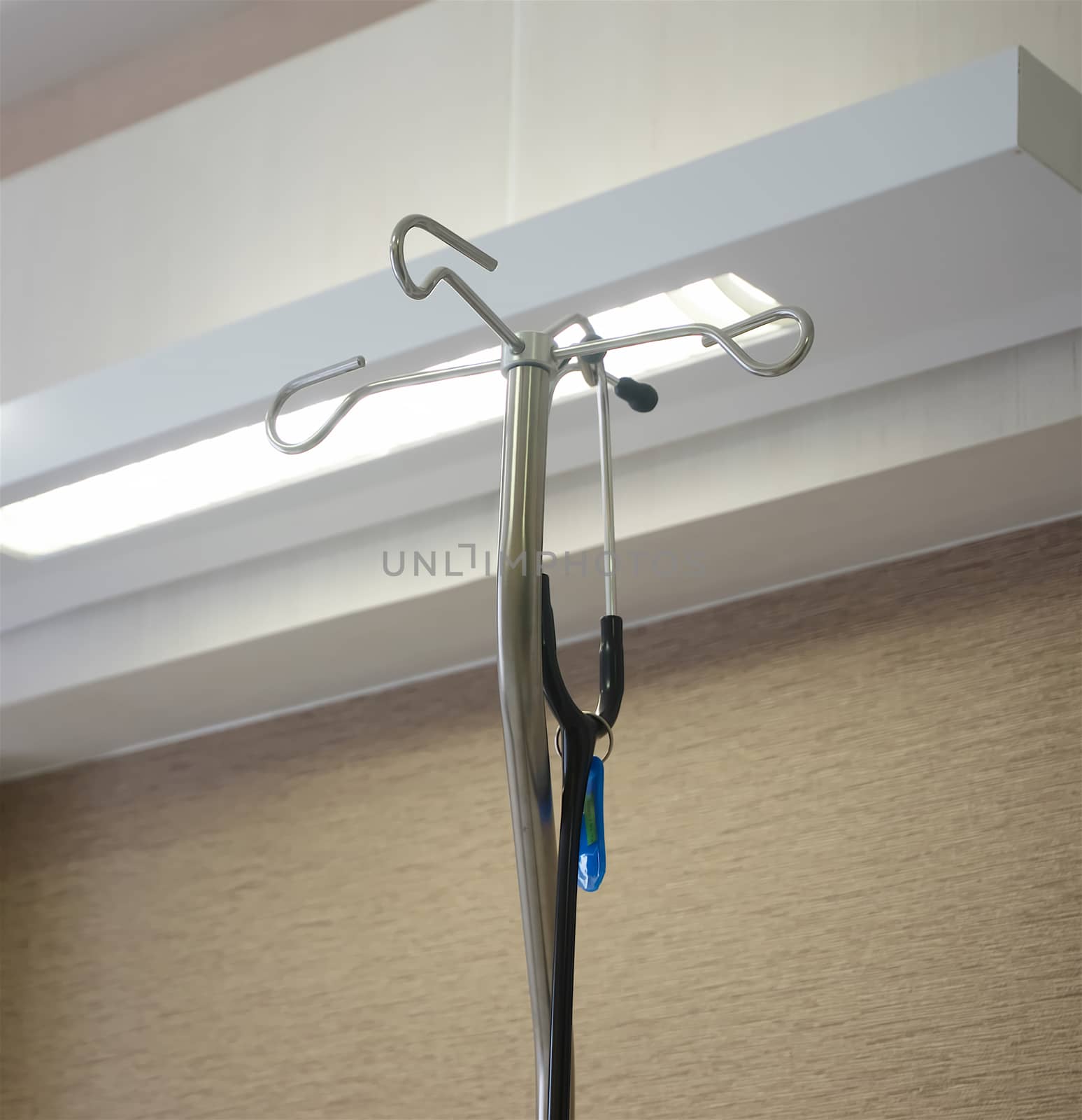 Stethoscope hanging on medical stand by ninun