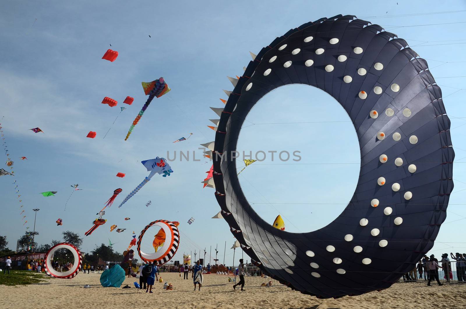 INDIA, Mangaluru: Kites are seen at Panambur beach, Mangaluru, south-east India on January 16, 2016 as the International Kite festival starts. 