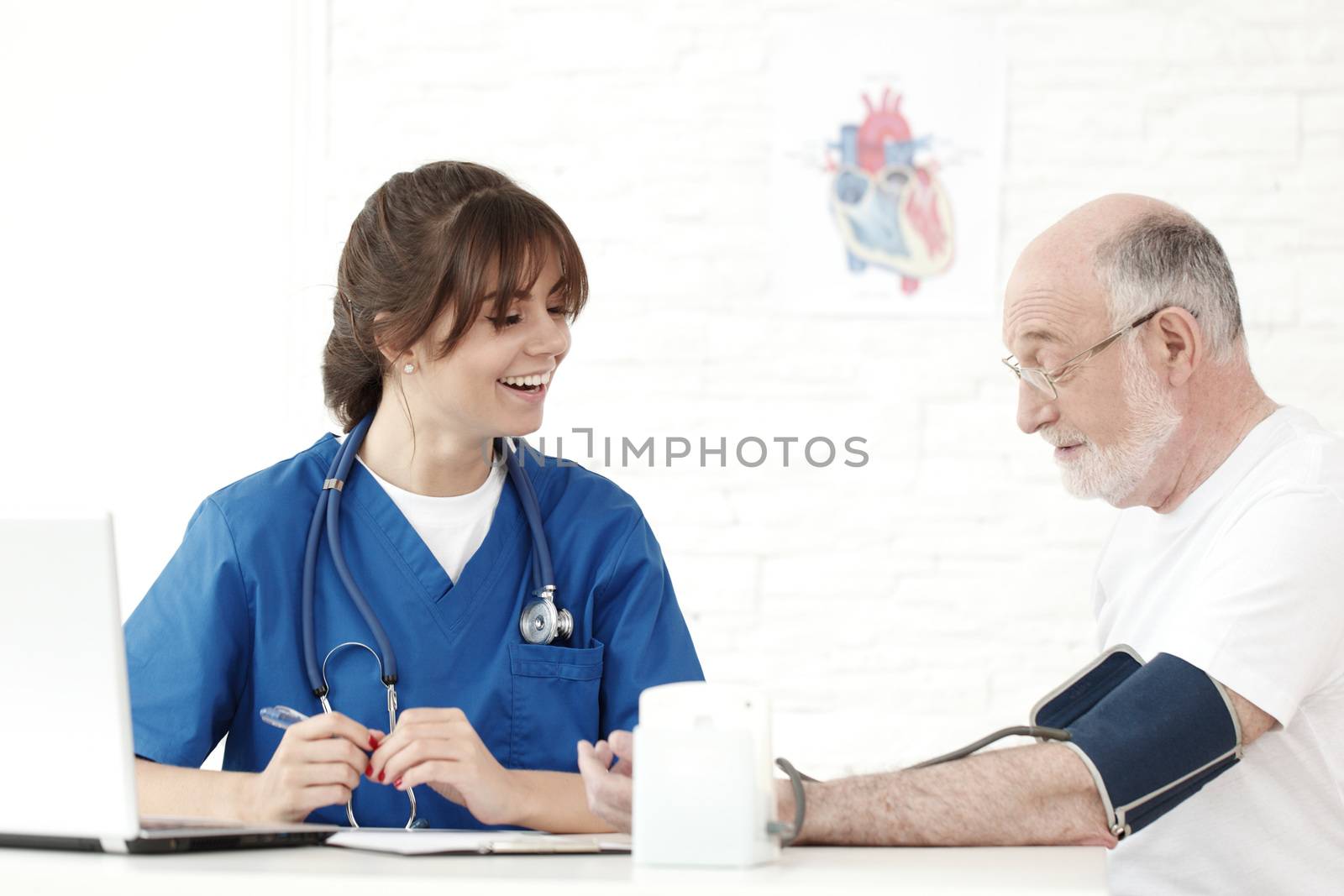 Doctor measuring blood pressure by ALotOfPeople