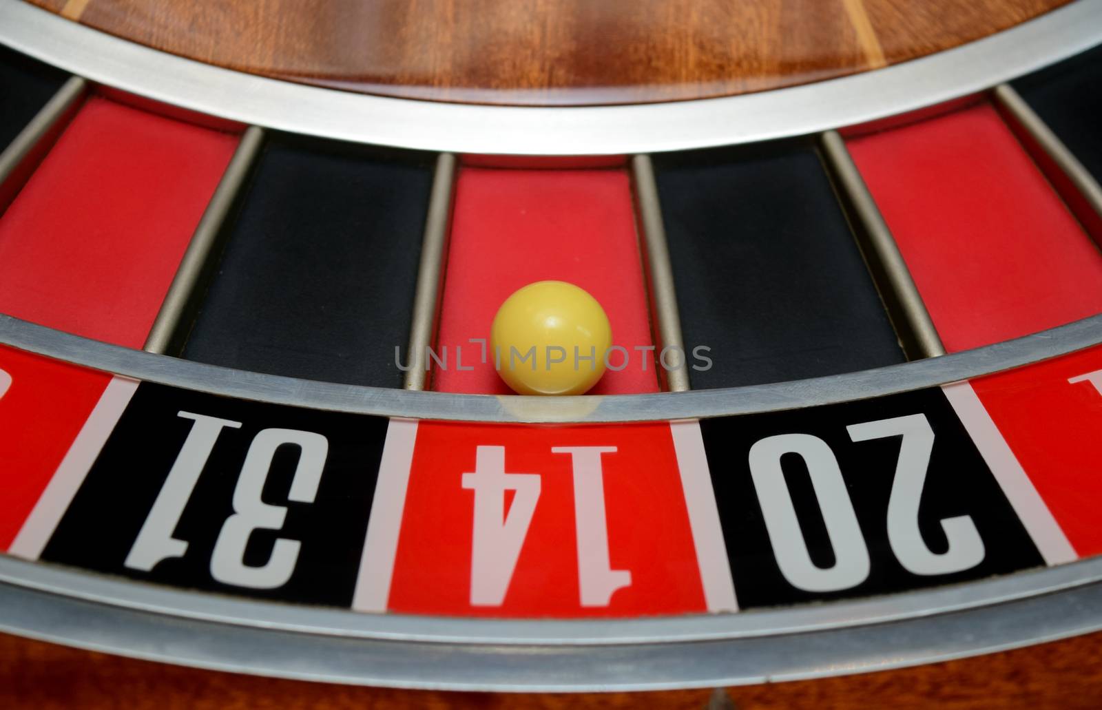 ball in winning number fourteen at roulette wheel