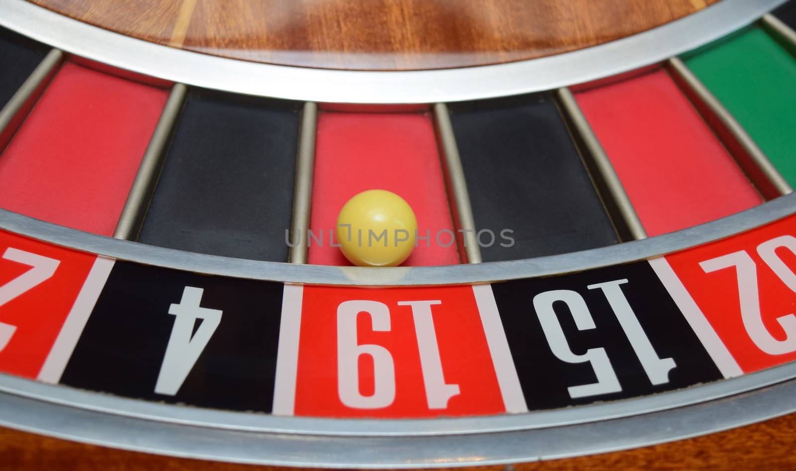 ball in winning number nineteen at roulette wheel