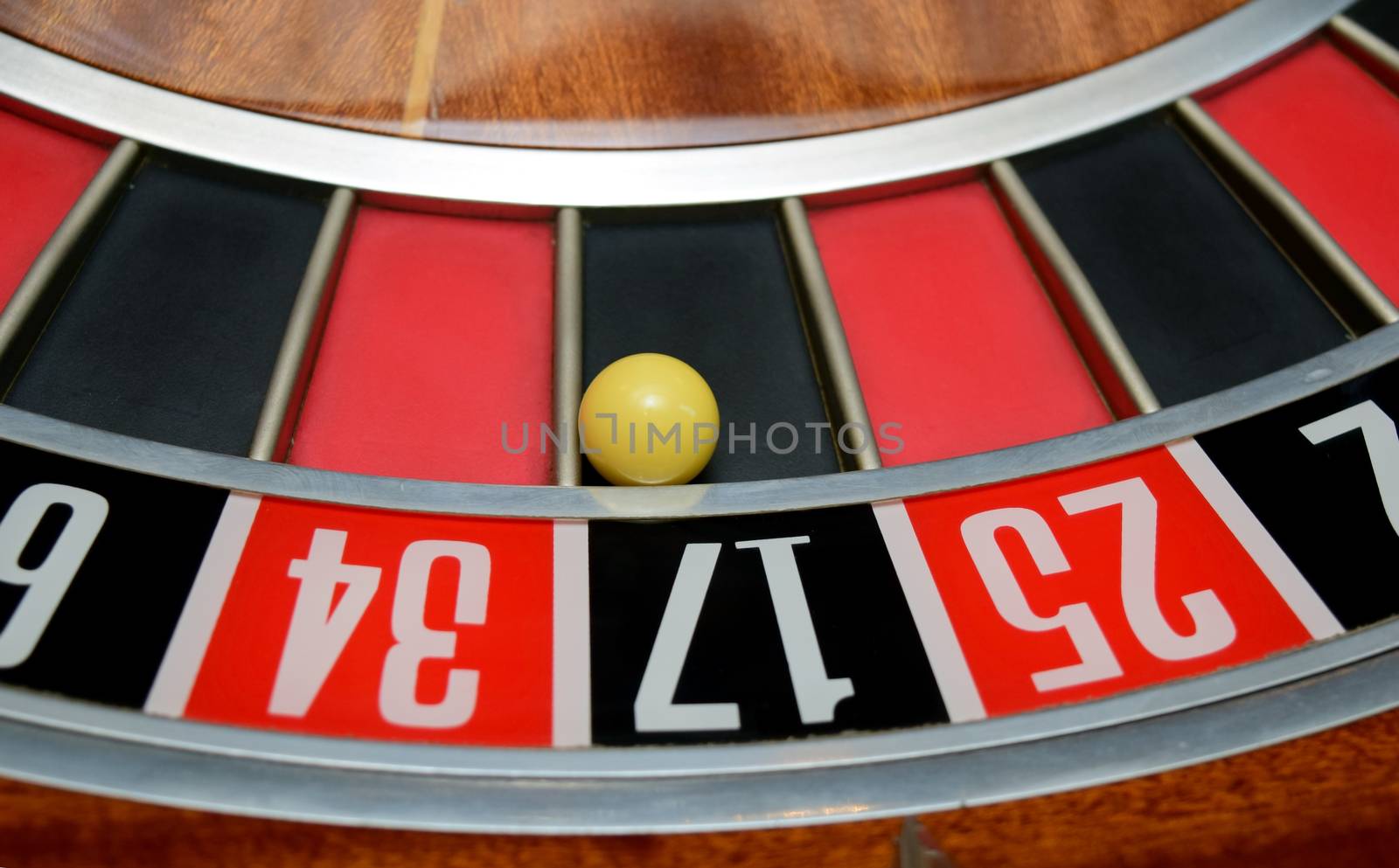 ball in winning nunber seventeen at roulette wheel