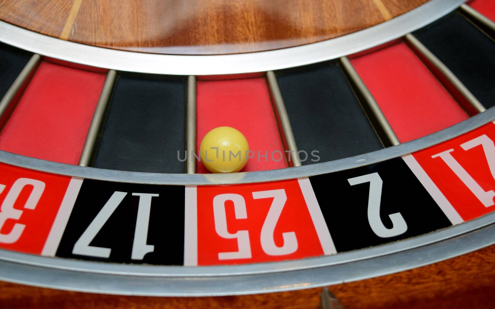 ball in winning number twenty five at roulette wheel