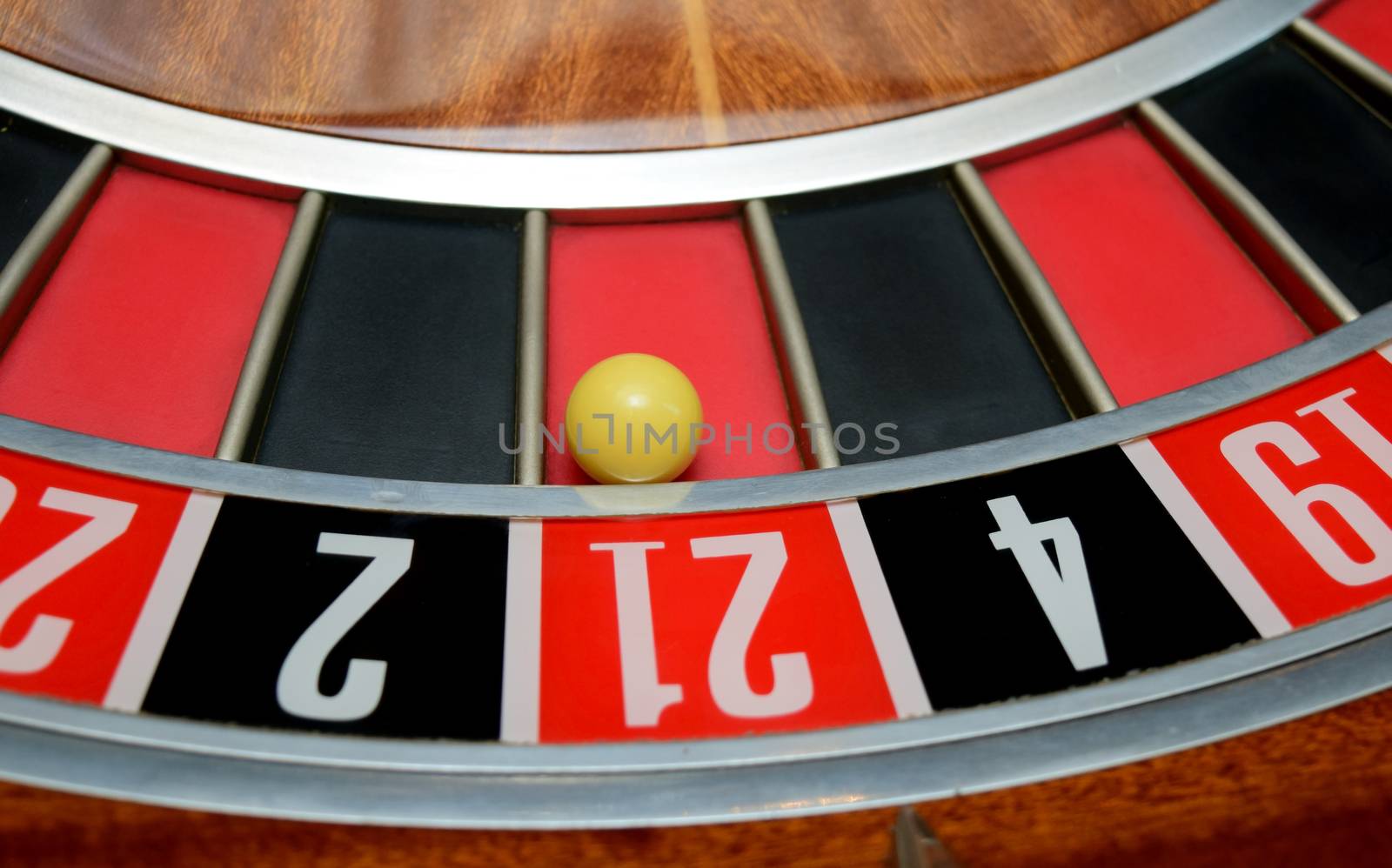 ball in winning number twenty one at roulette wheel