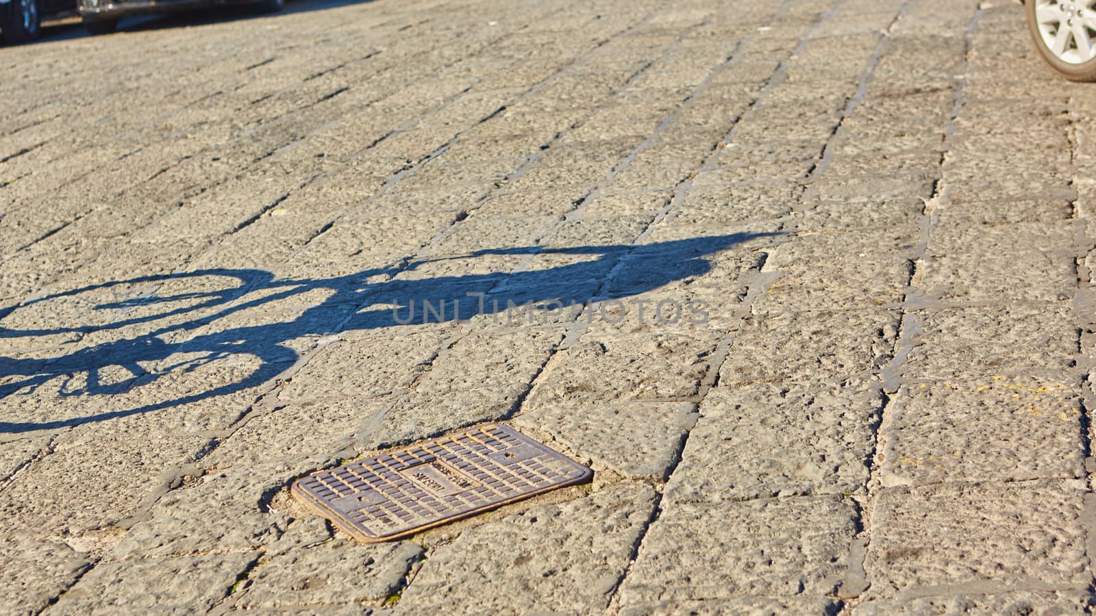 shadow of cyclist during sunset,  by sarymsakov