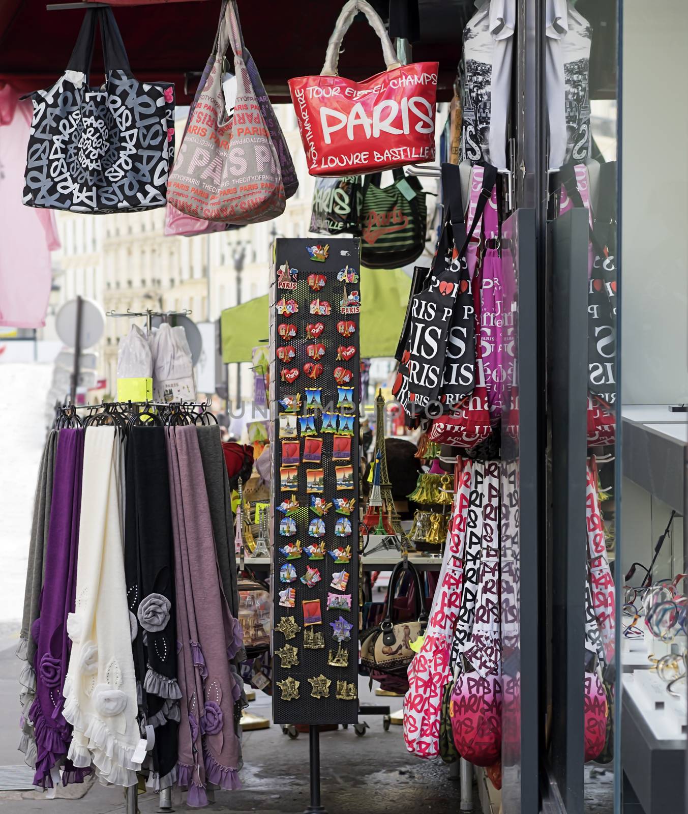 Colorful gifts and souvenirs in french street markets on sidewalks in paris