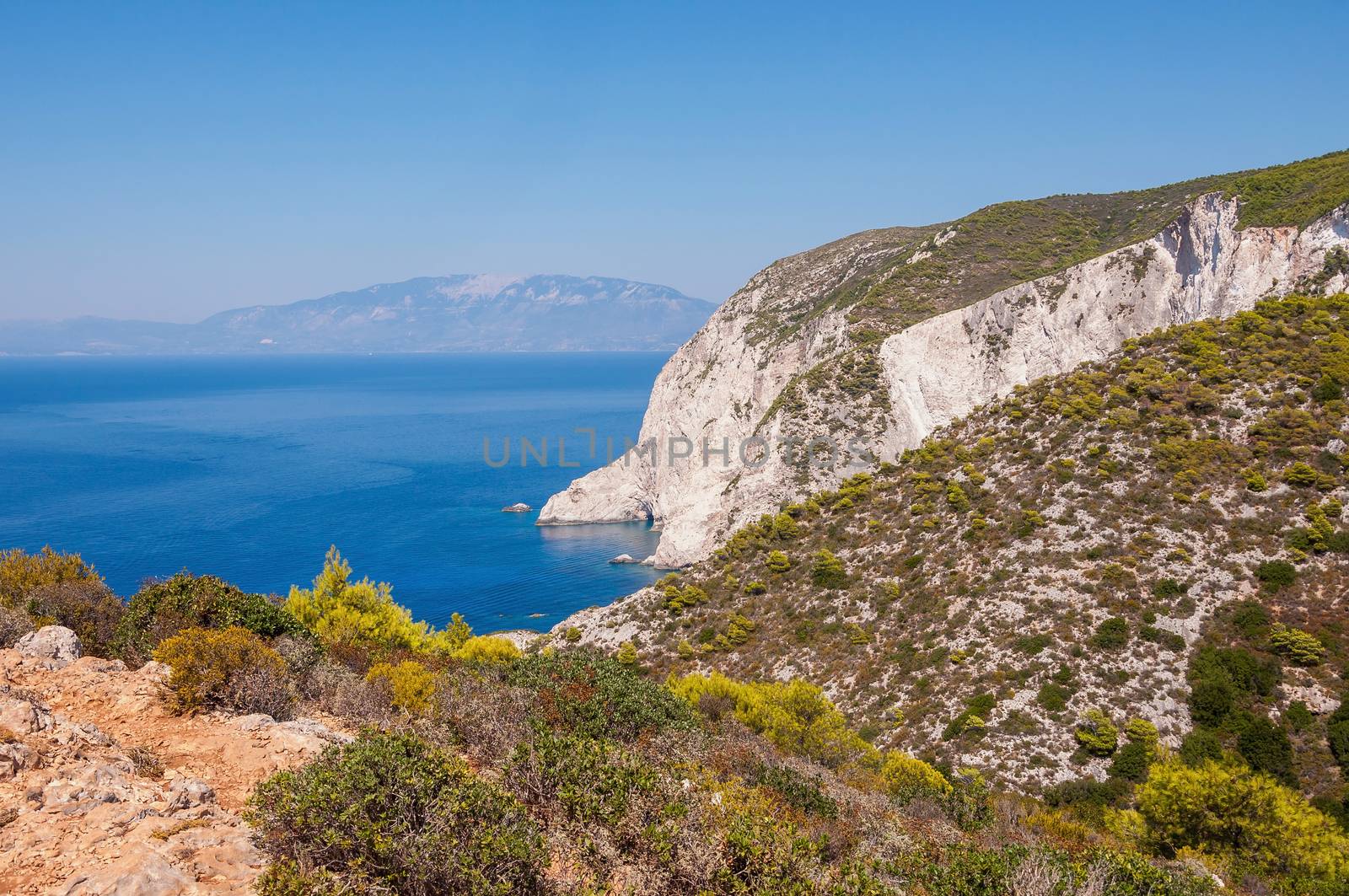 Beautiful cliff coast of Zakynthos seen from the top with Cephalonia Island in the background