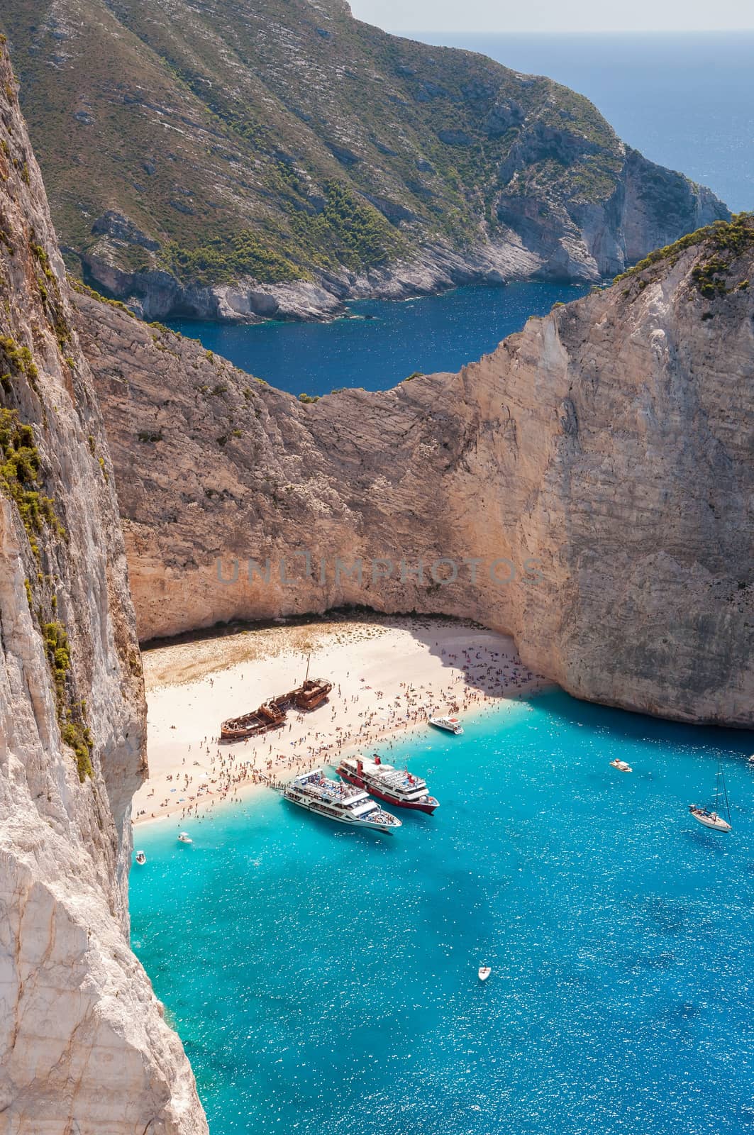 Crowded Navagio Beach on Zakynthos seen from the cliff