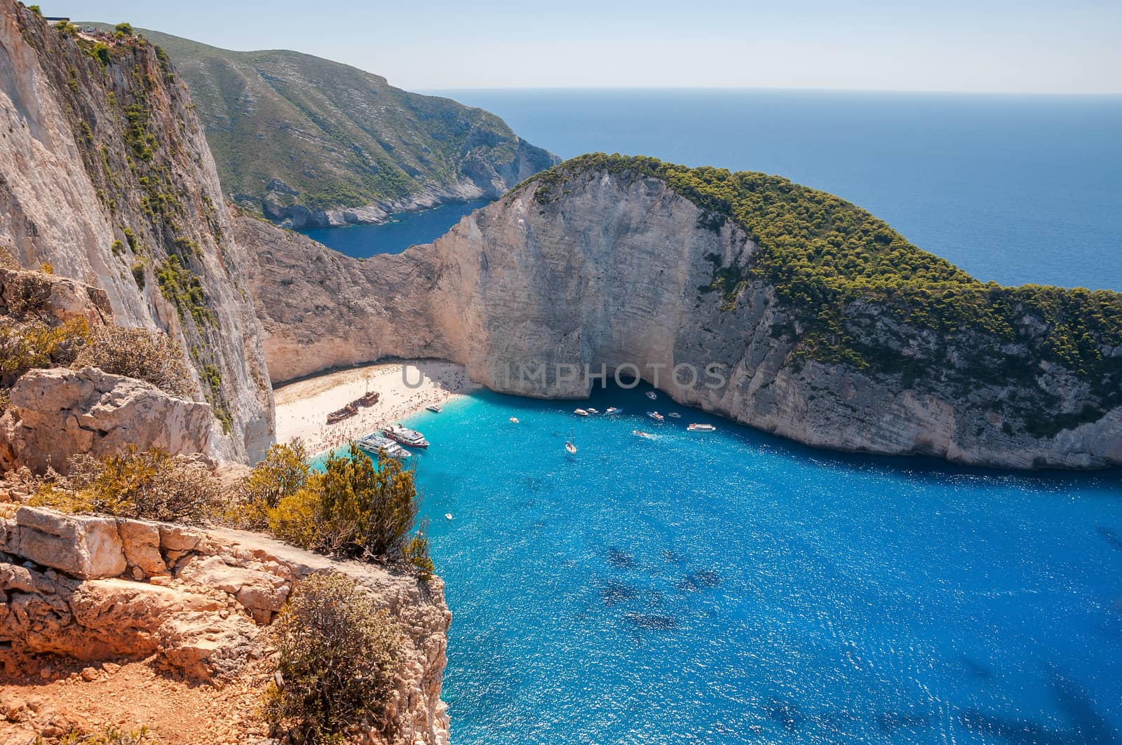 View of crowded Navagio Beach on Zakynthos by mkos83