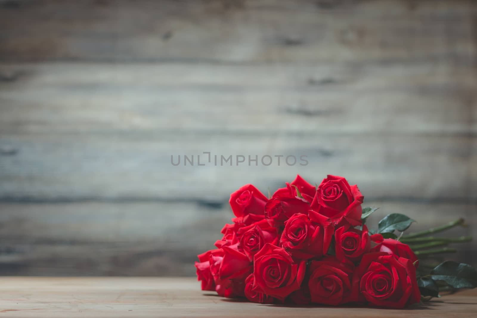 Valentines Day of Red rose on wooden background