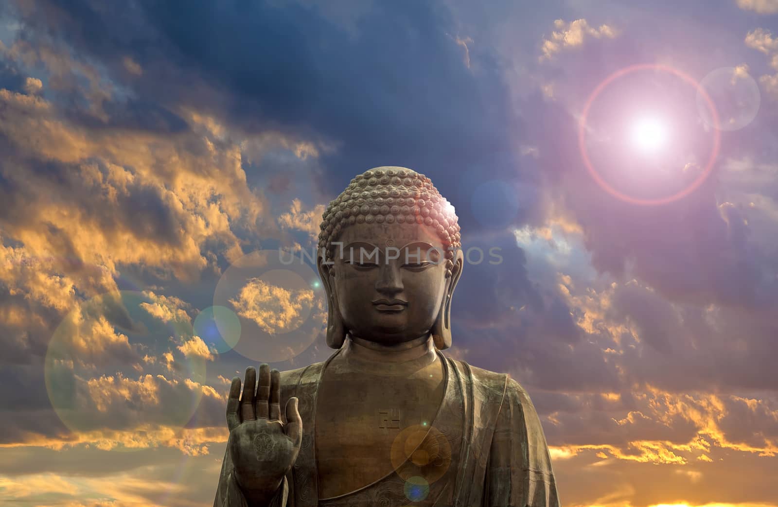 Tian Tan World Largest Sitting Bronze Buddha at Ngong Ping Village in Hong Kong with Clouds and Sun Flare Background