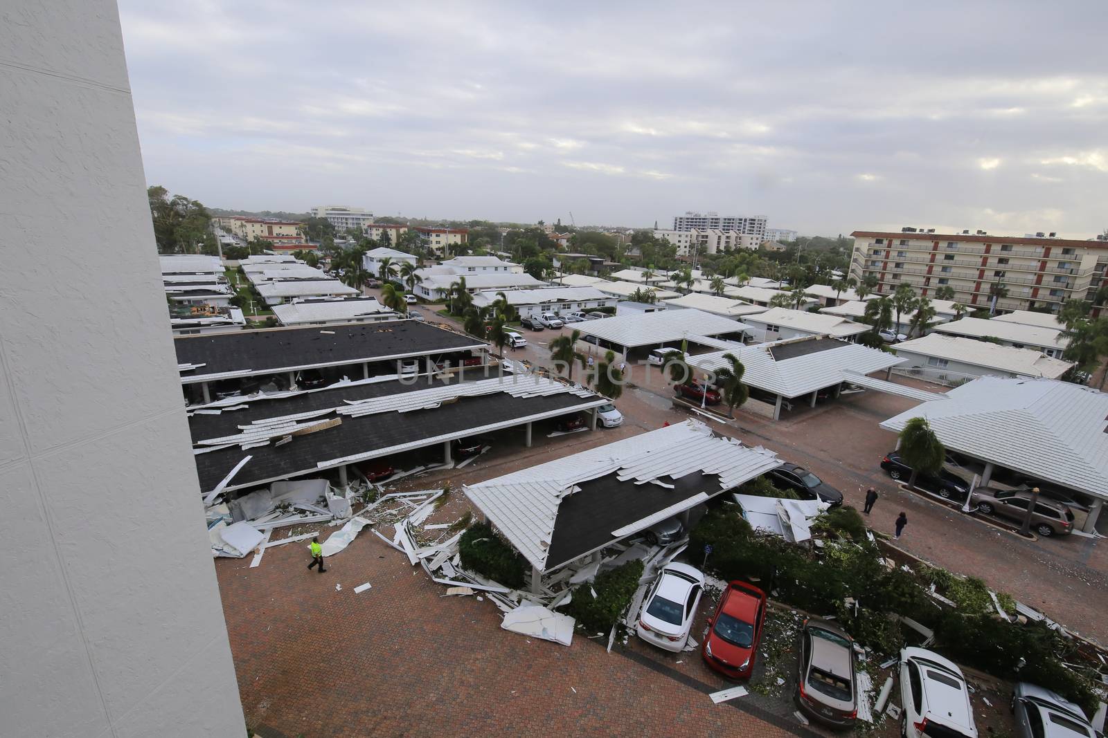 UNITED STATES, Siesta Key: A heavily damaged car park is seen in the aftermath of a tornado, on Midnight Pass Road in Siesta Key, Florida, on January 17, 2016. At least two people are dead near Sarasota after tornadoes and severe thunderstorms crossed central and South Florida on January 17, 2016. 
