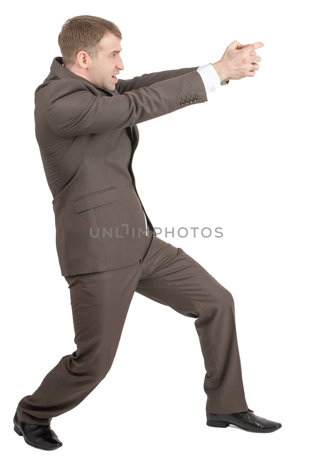 Businessman holding invisible gun by cherezoff