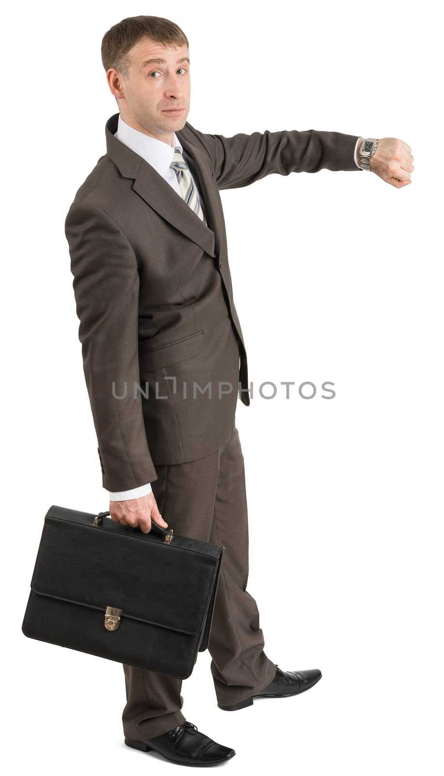 Businessman looking at his hand by cherezoff