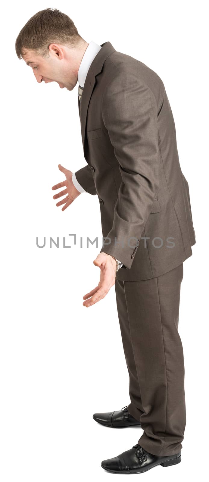 Businessman looking down and shouting isolated on white background