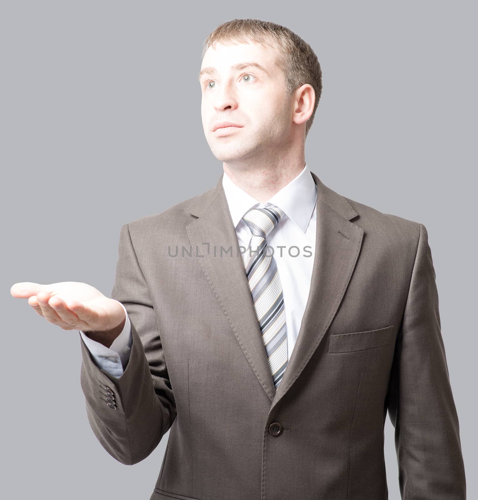 Businessman with outstretched empty hand, side view