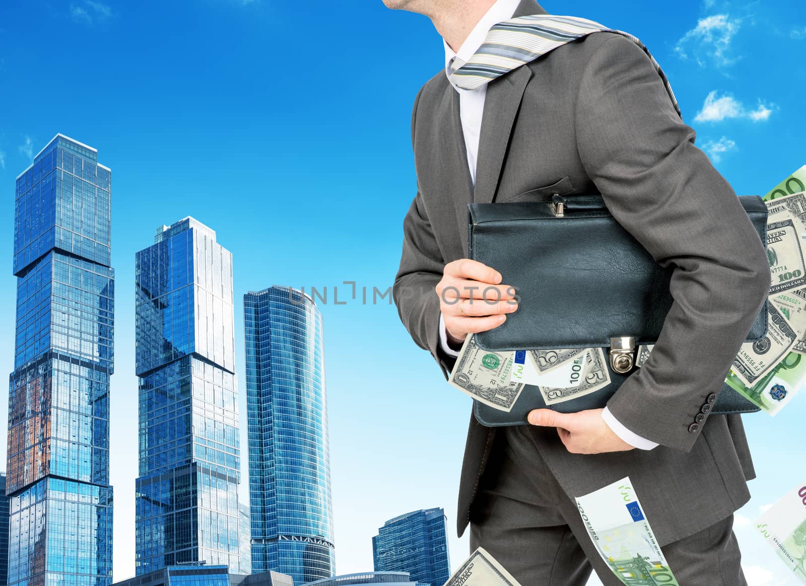 Businessman with suitcase full of money by cherezoff