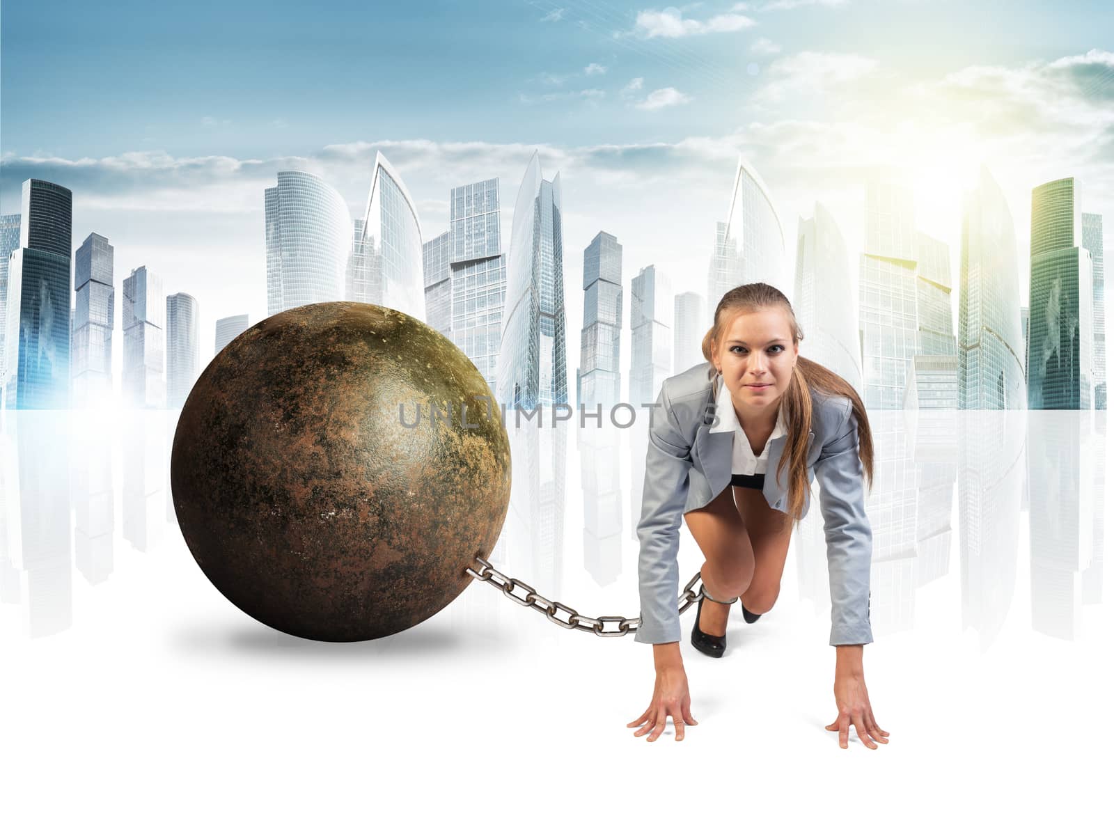 Businesswoman with iron ball isolated on cityscape background