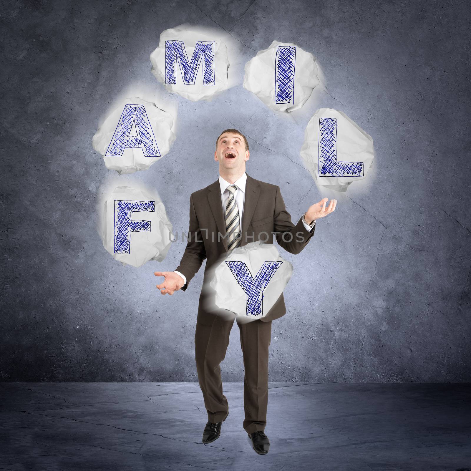 Businessman juggling word family by cherezoff