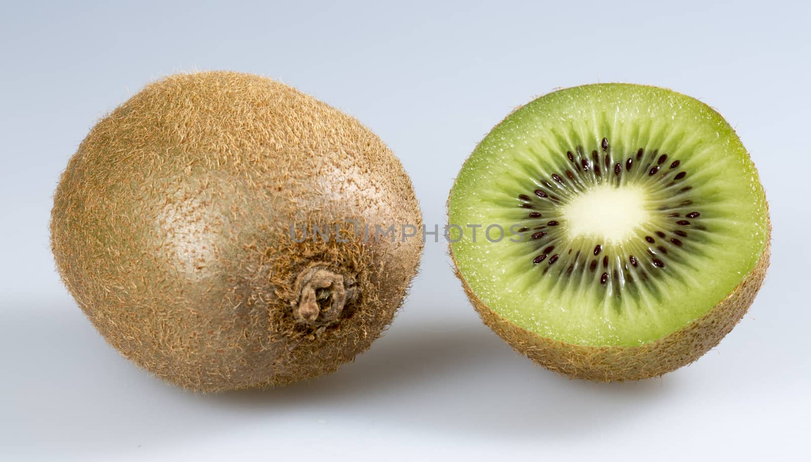 Kiwifruit Close Up. One sliced and one whole one.