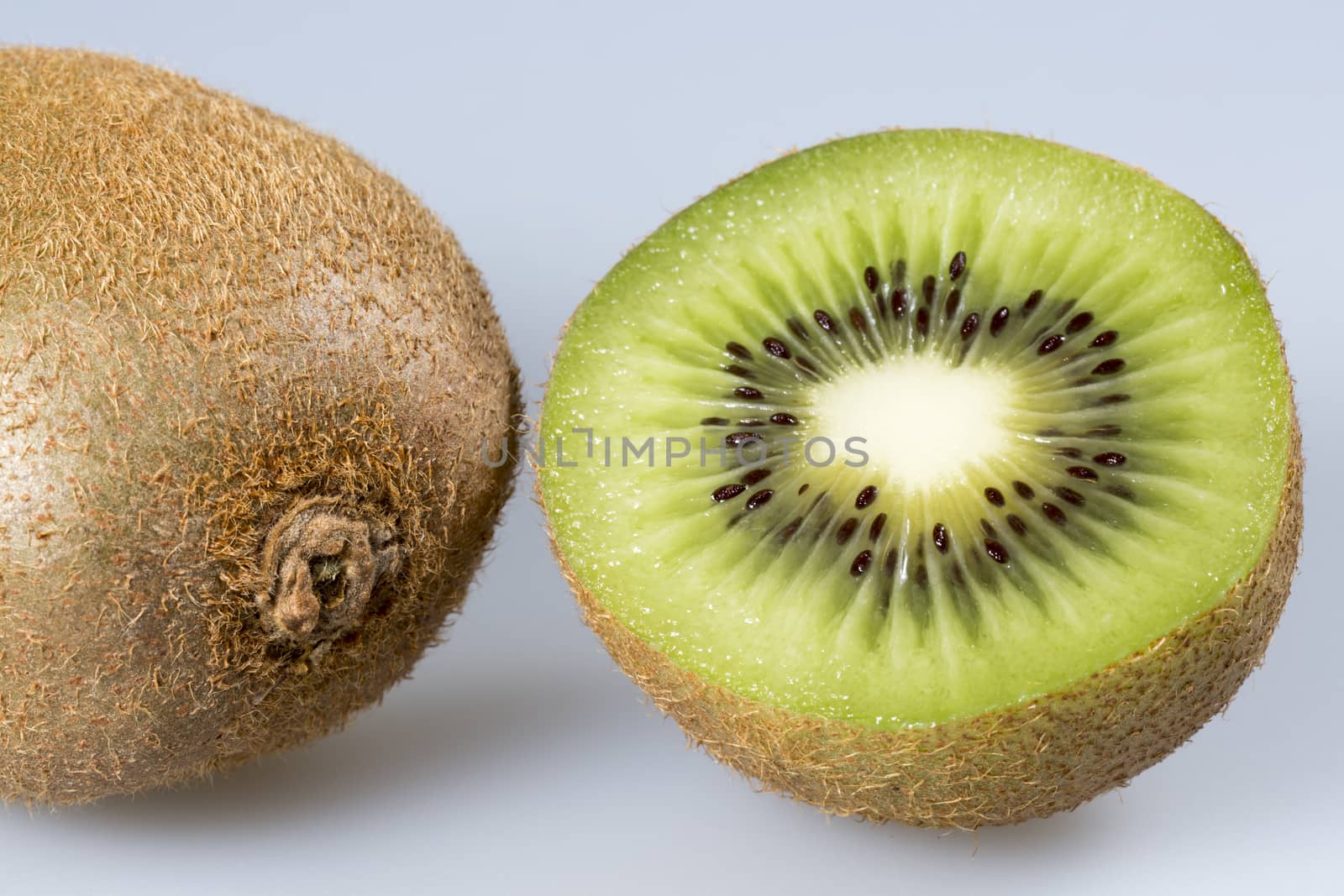 Kiwifruit Close Up. One sliced and one whole one.
