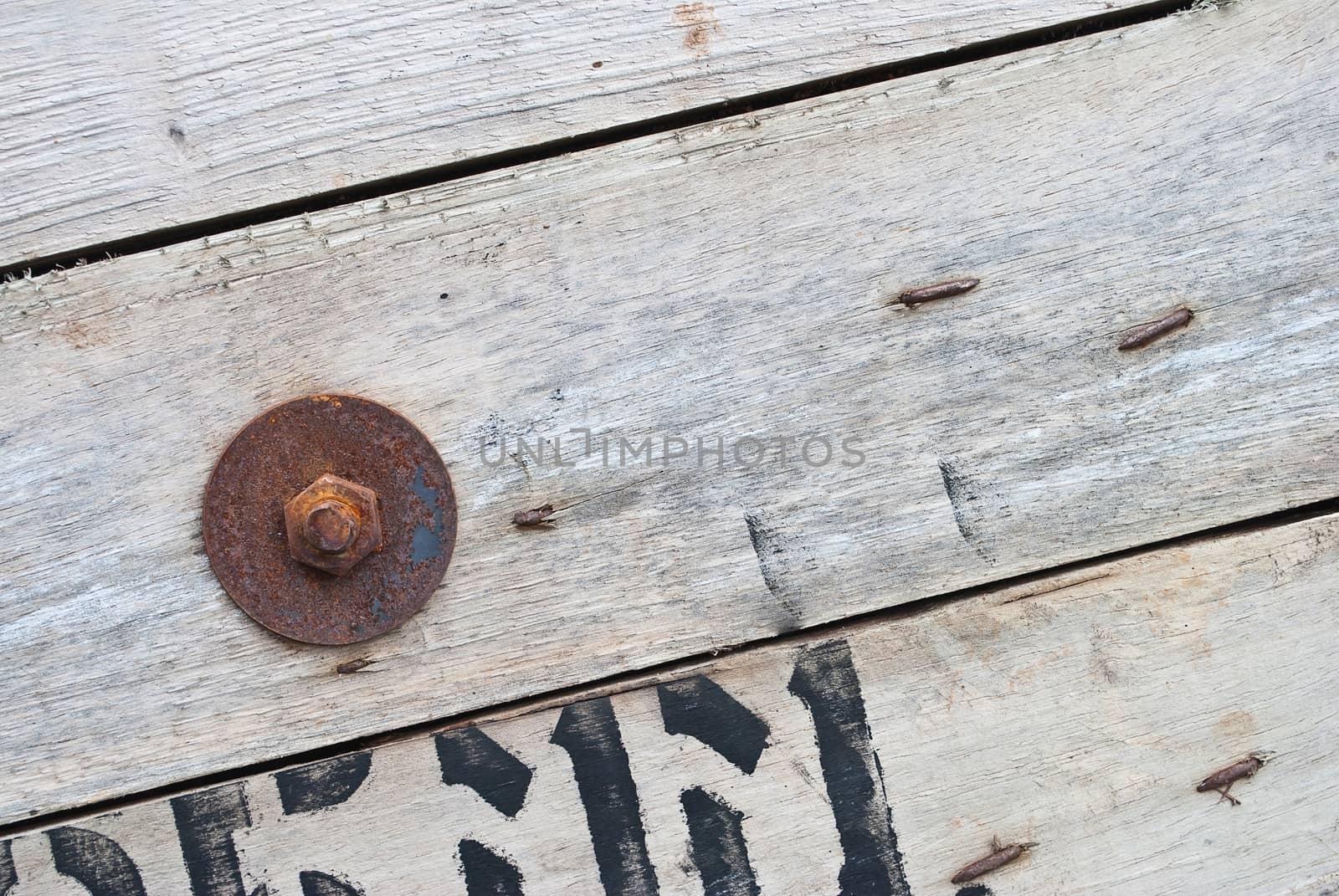 Old wood with rusty old nuts, texture for background by rakoptonLPN