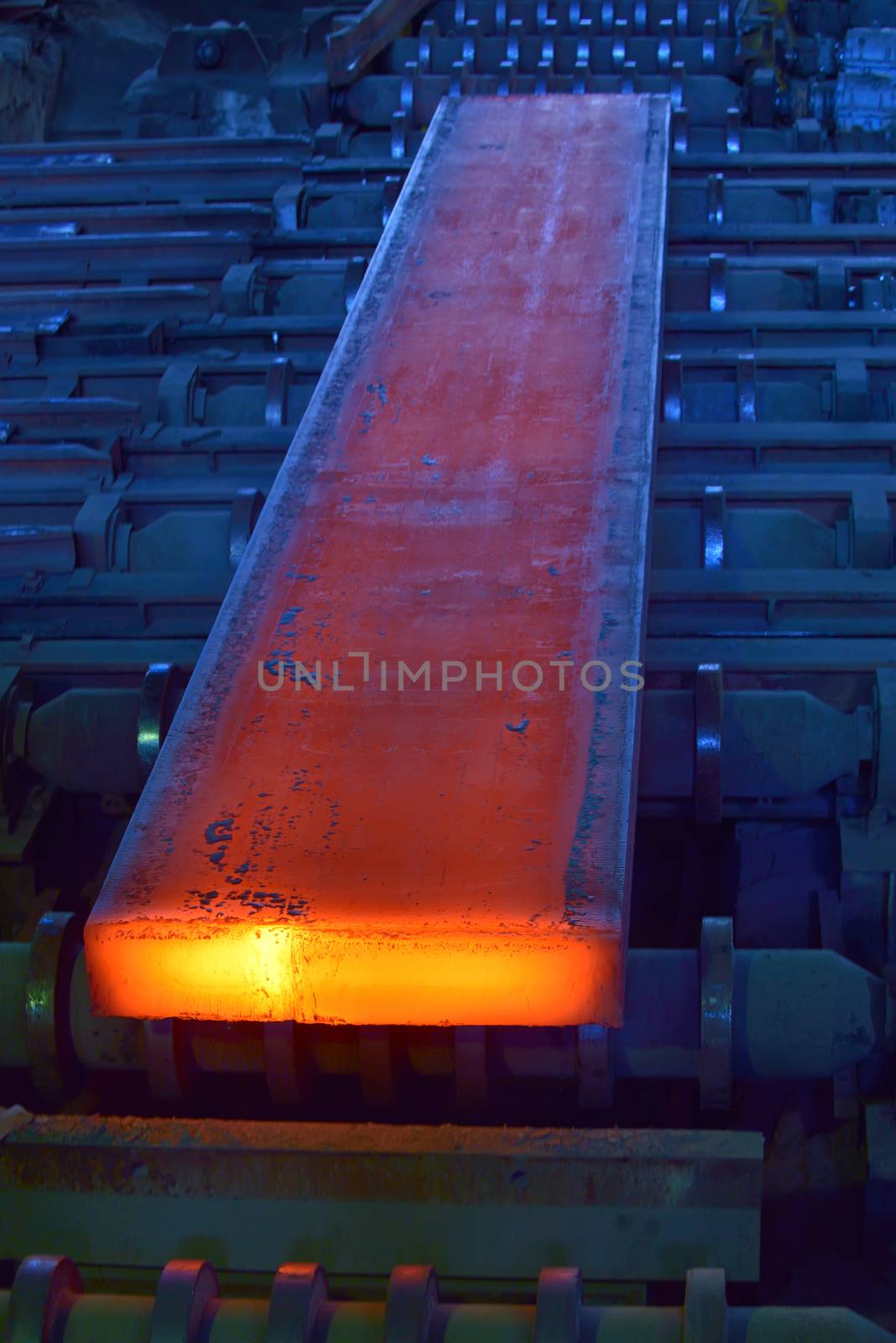 hot steel on conveyor inside of steel plant

