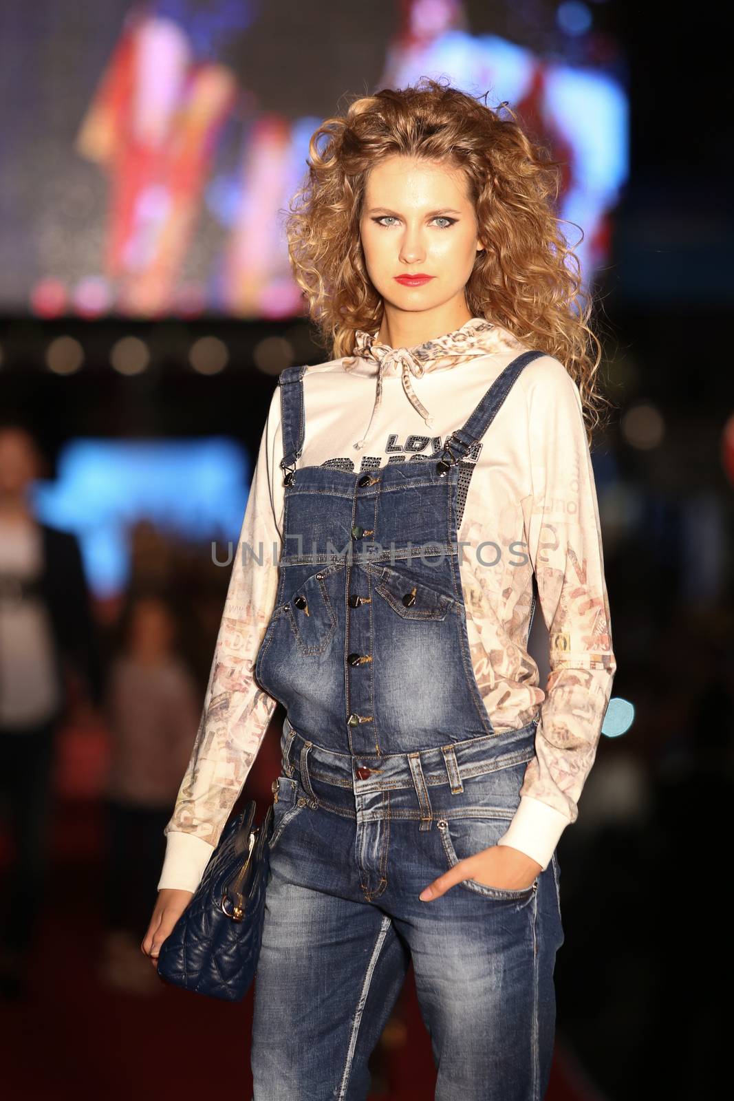 ISTANBUL, TURKEY - AUGUST 25, 2015: A model showcases one of the latest creations in Laleli Fashion Shopping Festival