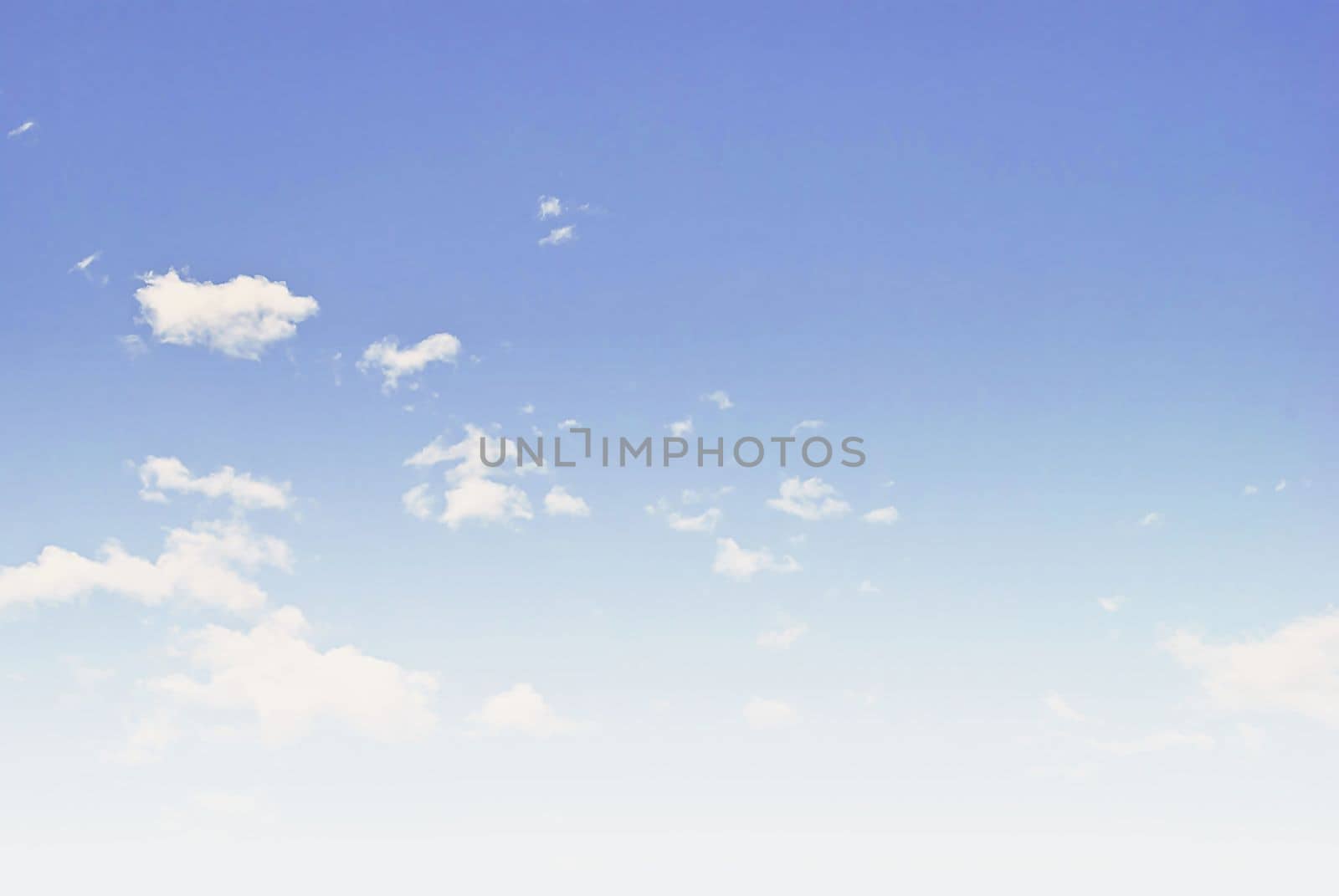 white fluffy clouds in the blue sky by rakoptonLPN