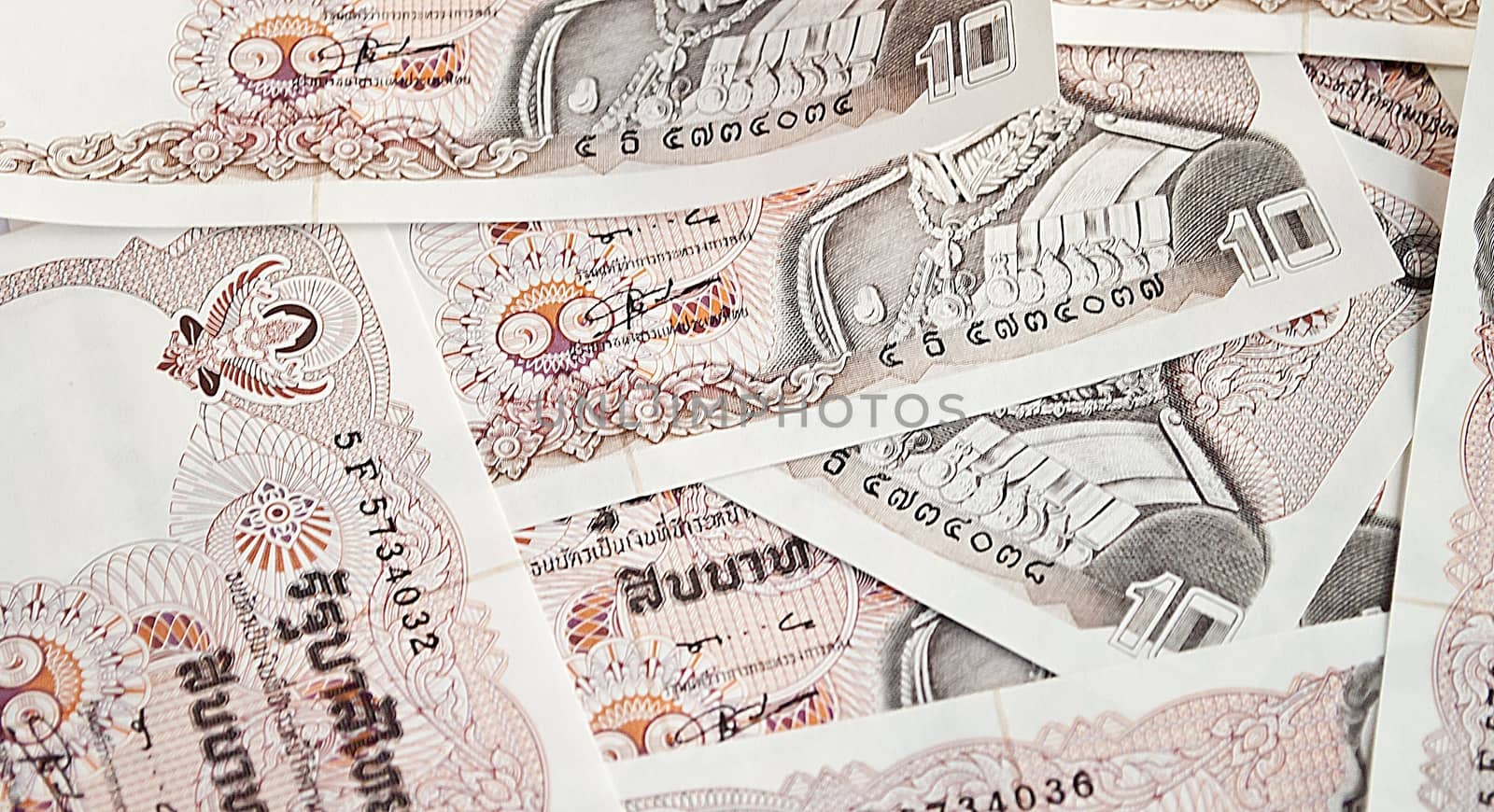 thai money banknotes ten baht closeup background by rakoptonLPN