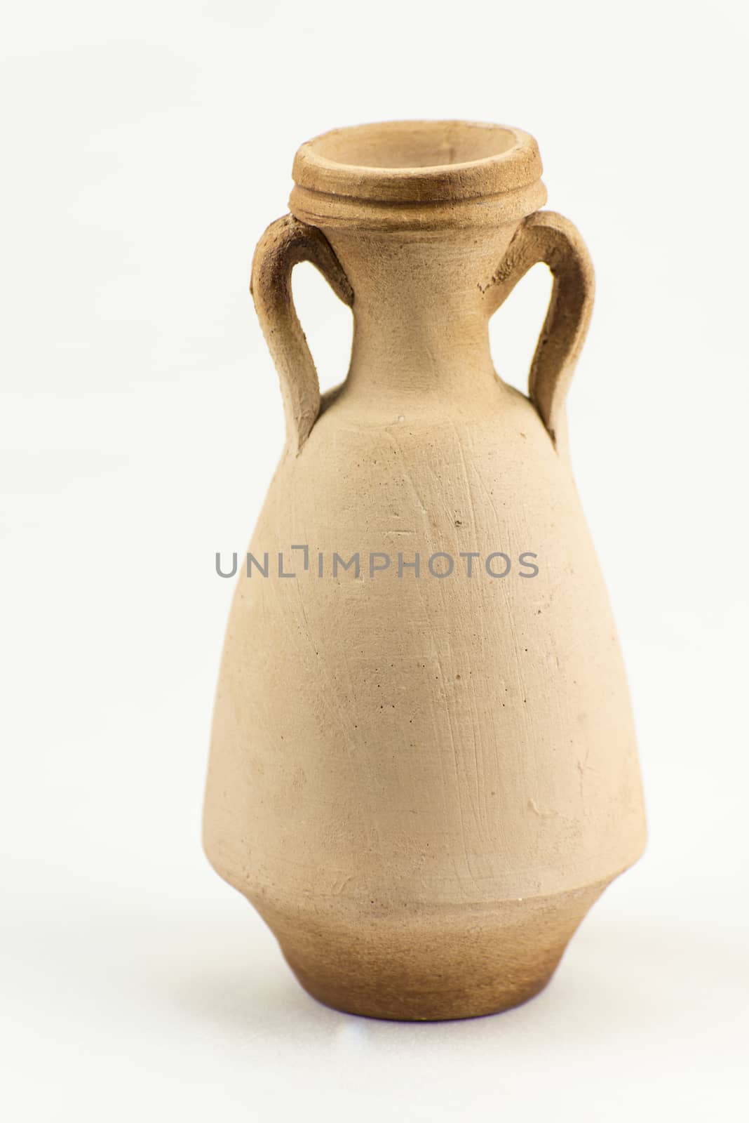 Ancient terracotta vase isolated on white background