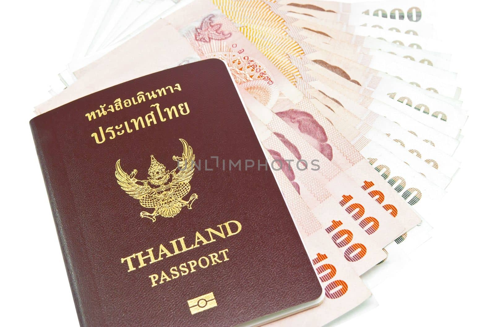 Thailand passport with Thai money ready to travel on white background by rakoptonLPN