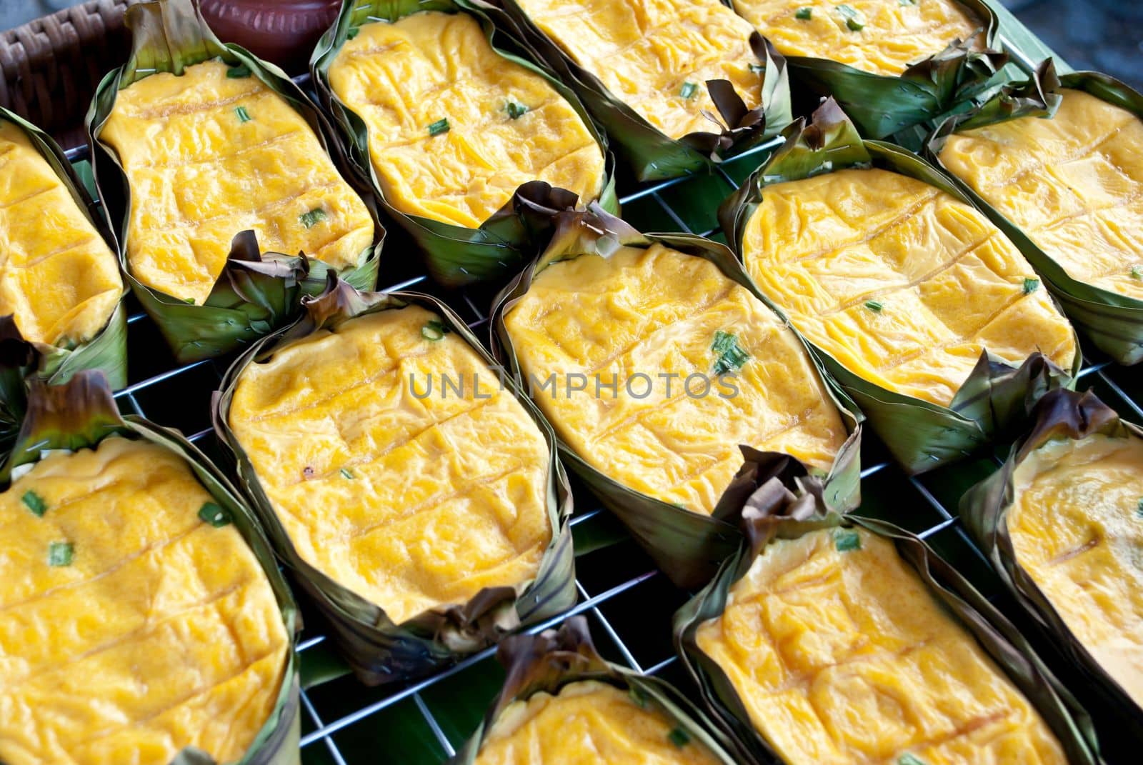grilled eggs with banana leaf, lanna food, asian food by rakoptonLPN