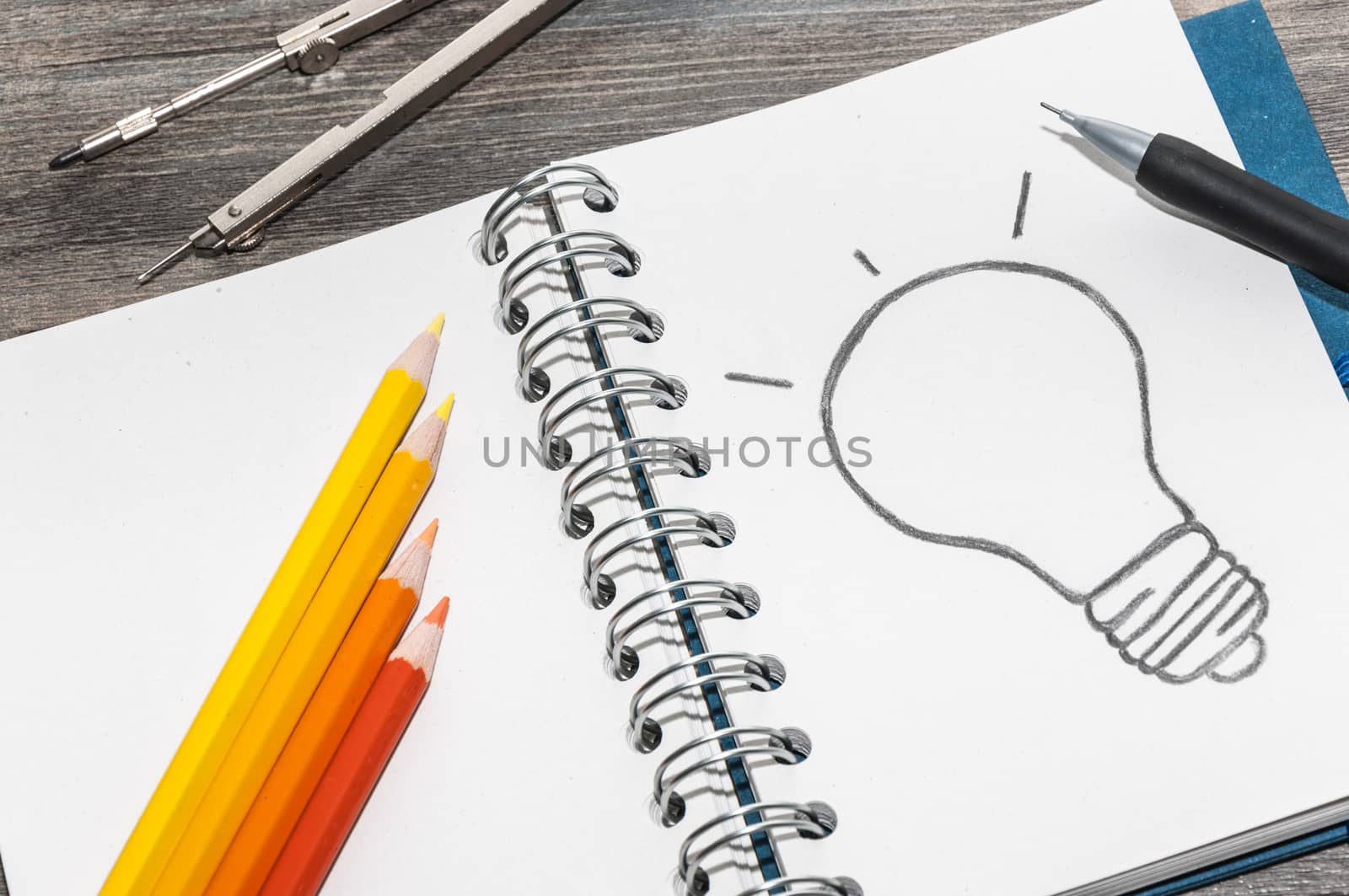 Drawing a bulb on a notepad by Mariamarmar