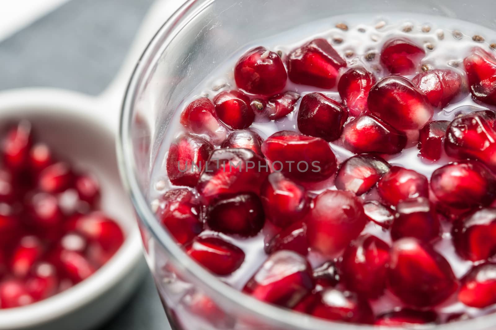 Seeds of pomegranate on a slate background